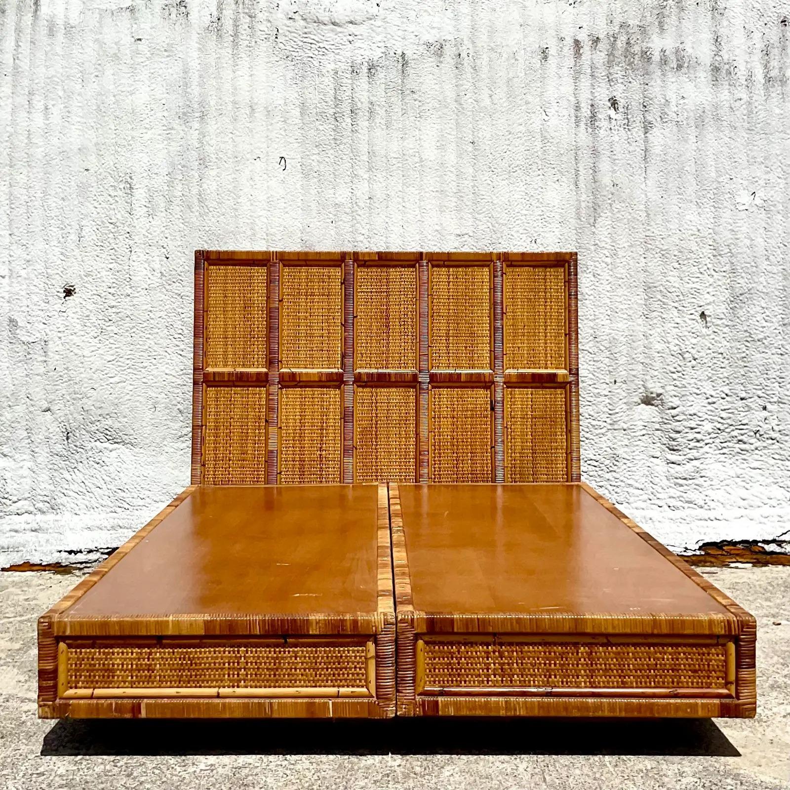 A fantastic vintage Coastal Queen platform bed. Beautiful woven rattan frame with a raised boat form body. No box spring needed, the mattress just rests on the base. Acquired from a Palm Beach estate.