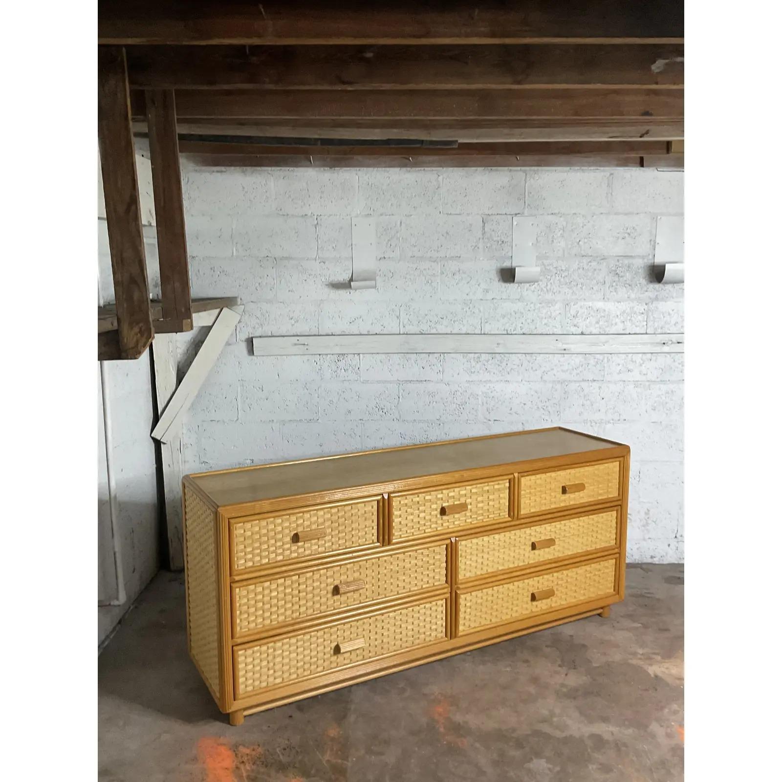 Fantastic vintage Coastal standard dresser. Beautiful warm blond wood cabinet with 7 woven rattan drawer fronts. Acquired from a Palm Beach estate.