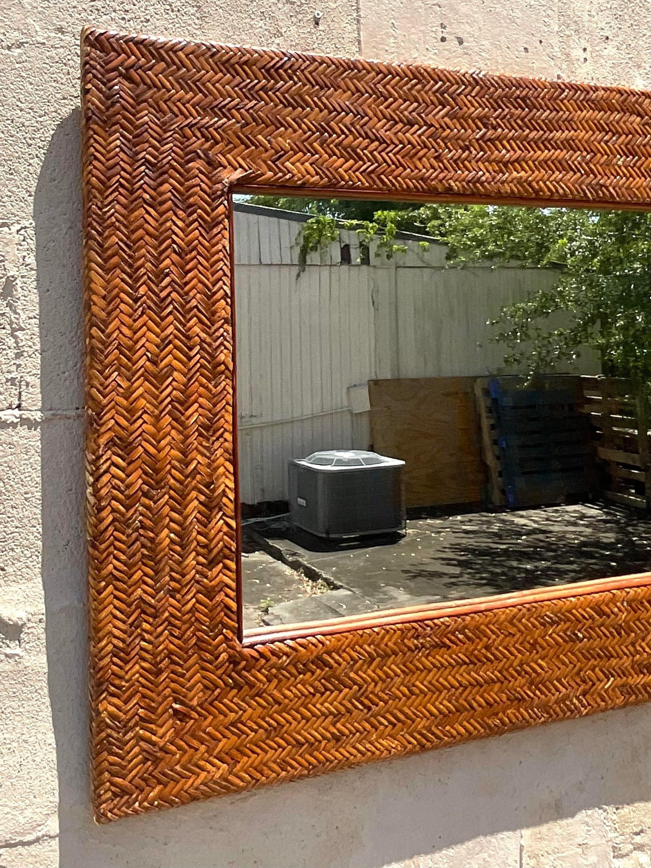 Capture coastal charm with our Vintage Coastal Wrapped Rattan Horizontal Mirror. Infused with American flair, this unique piece showcases hand-woven rattan detailing, blending natural beauty with classic design for a relaxed yet sophisticated look.