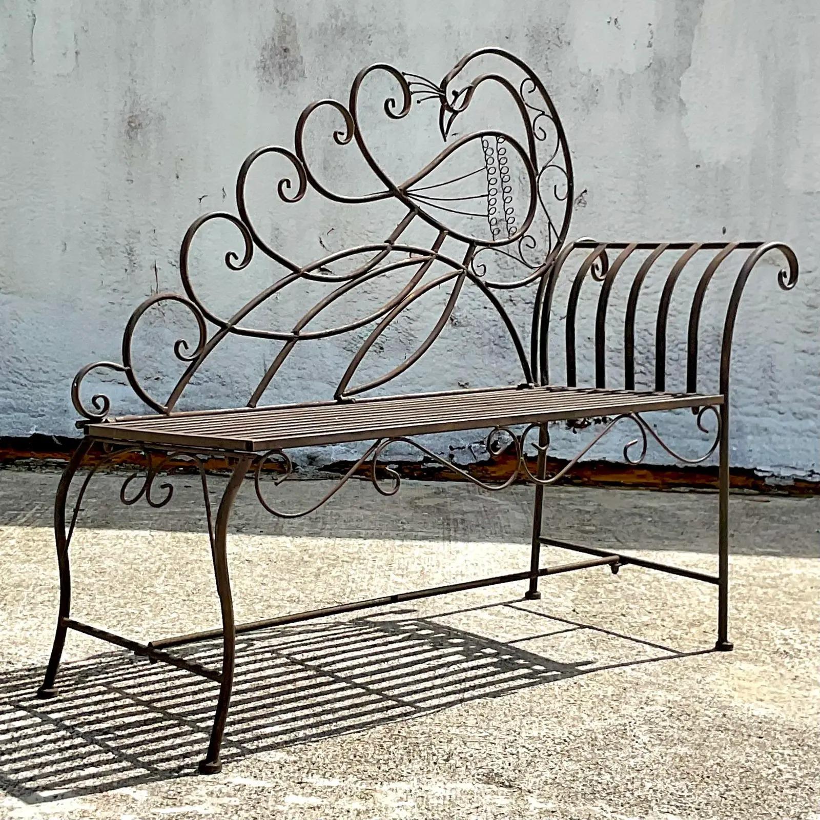 A fantastic vintage Coastal wrought iron bench. A beautiful peacock design with a high dramatic back. Perfect as is or change any color you like. You decide! Use in indoors or outdoors. Acquired from a Palm Beach estate.