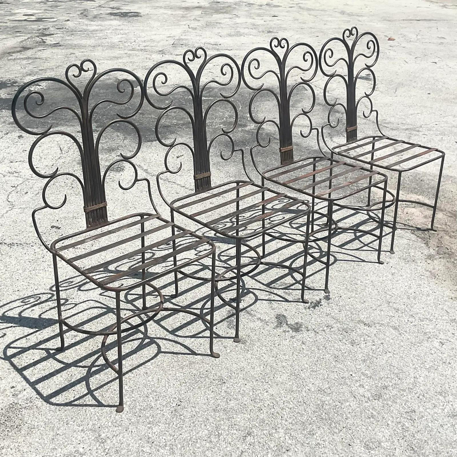 Fantastic vintage Wrought iron dining chairs. A gorgeous hand wrought swirl design. Perfect as is or have them paintings in a fresh bright color. Acquired from a Palm Beach estate.