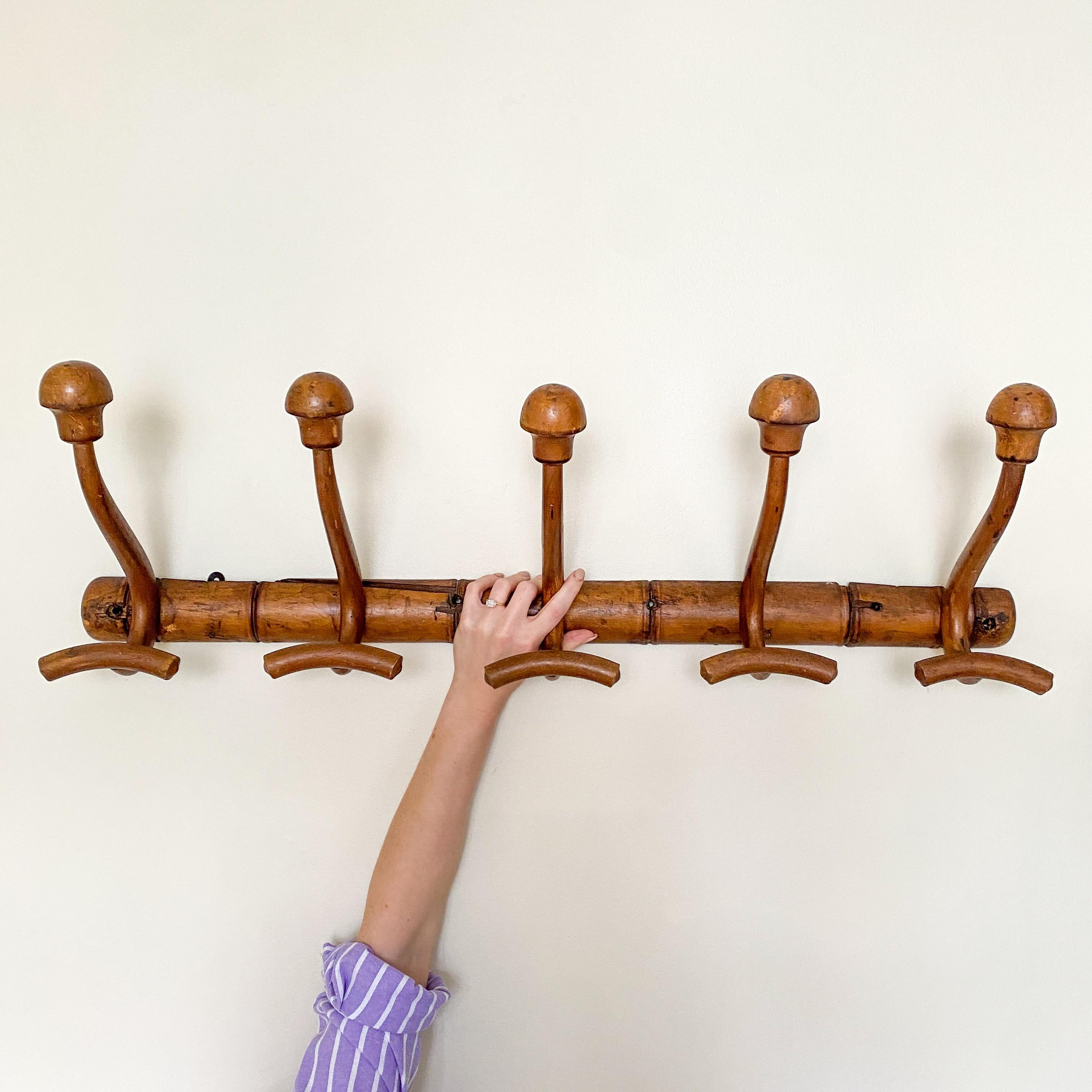 Elevate your entryway or mudroom with the timeless charm of these Vintage Coat Hooks. Crafted from sturdy wood, this coat rack features a row of classic hooks, providing ample space for hanging coats, hats, scarves, and more. With its rustic appeal