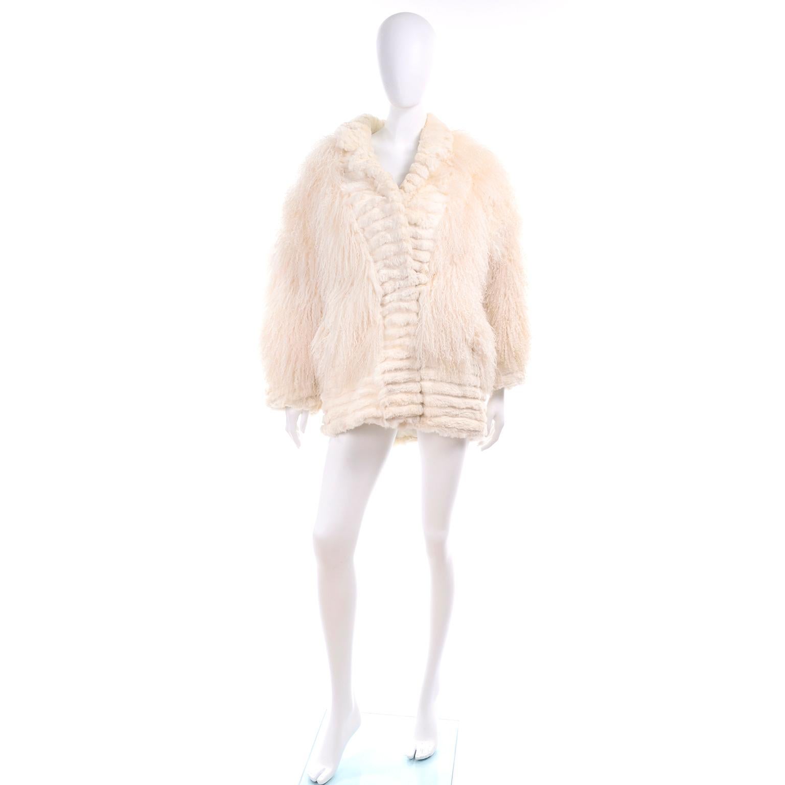 We are in love with this beautiful creamy ivory Tibetan lamb fur coat with rabbit fur trim and ivory silk lining. The jacket closes with fur coat style hooks and has the Maison Blanche and Made in Hong Kong labels.  This beautiful coat has side slit