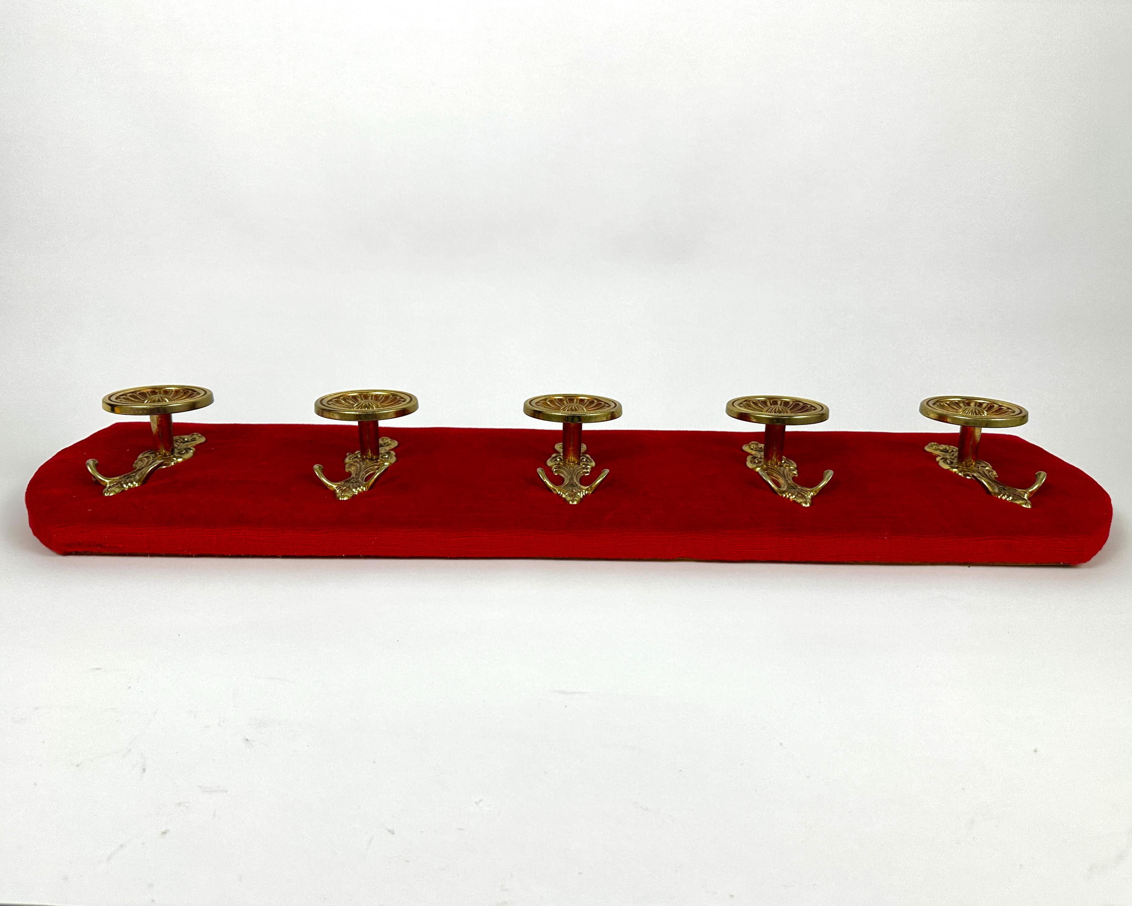 A great vintage wall hanging coat rack with red velvet and brass hooks from France, 1970s.

The set includes a coat rack and 5 hooks. 

A coat rack in the hallway is a convenient and practical element that helps organize the space and provides quick
