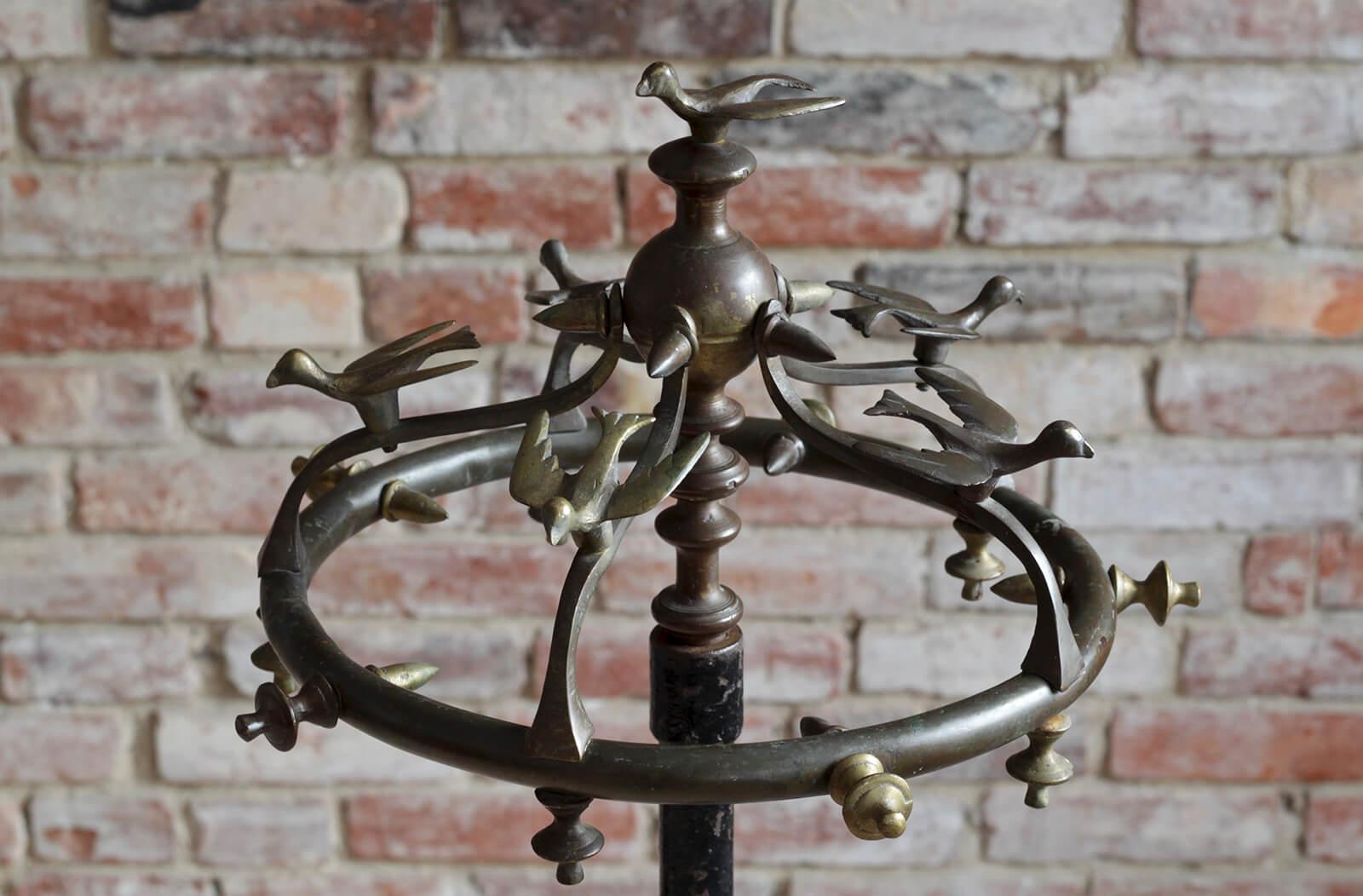 This is a unique and very original coat rack. The base is stamped by Seecol Company - Strand Electric & Engineering Co. and probably comes from early 20th Century. It is made of cast iron which provides high stability due to its weight. Extremely