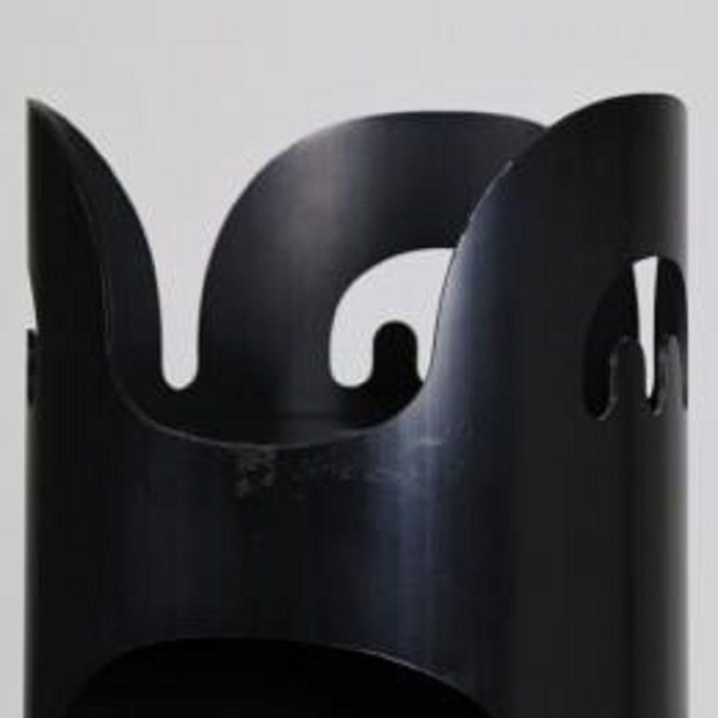 This vintage coat rack is a piece of design furniture realized by Enzo Mari for Danese Milano in 1968.

Standing coat rack in black plastic made of openings along the body which can be used to hang articles of clothing, umbrella, keys.

Marked