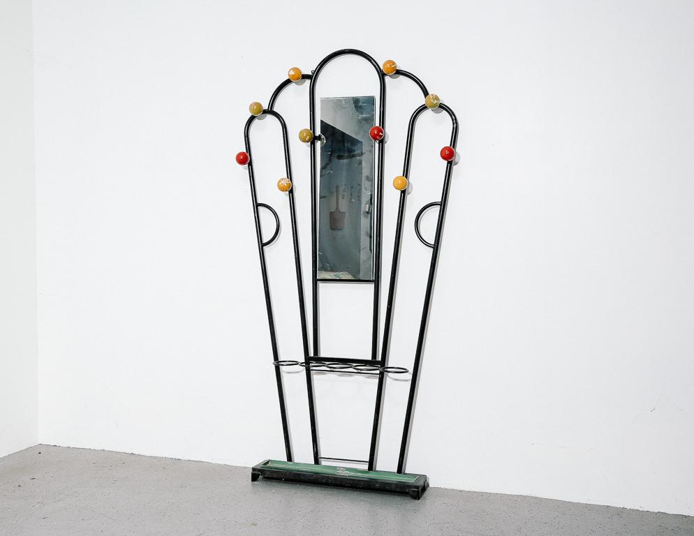 Vintage coat rack in painted tubular steel with colorful ball hooks. Integrated mirror and umbrella stand. In the style of Roger Feraud.