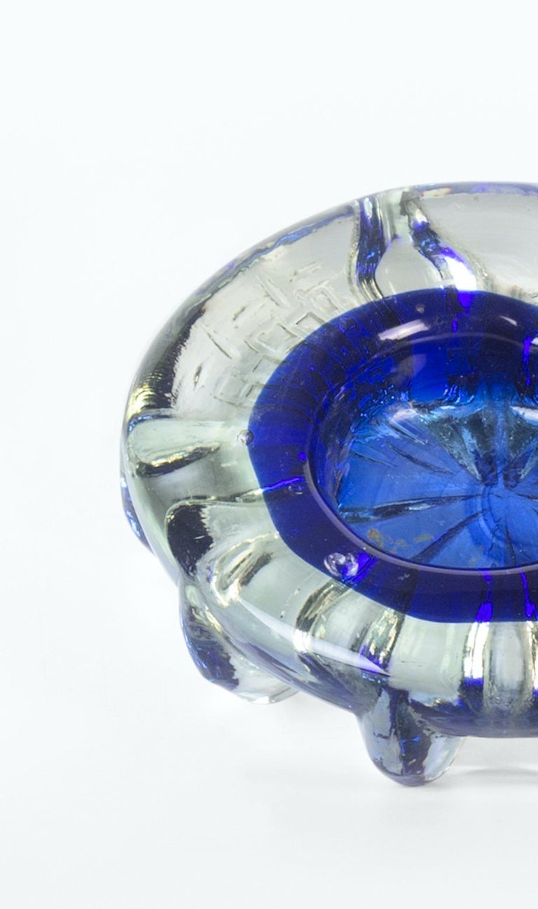 Vintage cobalt blue ashtray is an elegant glass decorative object, realized during the 1970s. 

Vibrant cobalt blue ashtray will help add a pop of blue in any tablescape of setting.

This 1970s cobalt blue glass ashtray is perfect for yesteryear