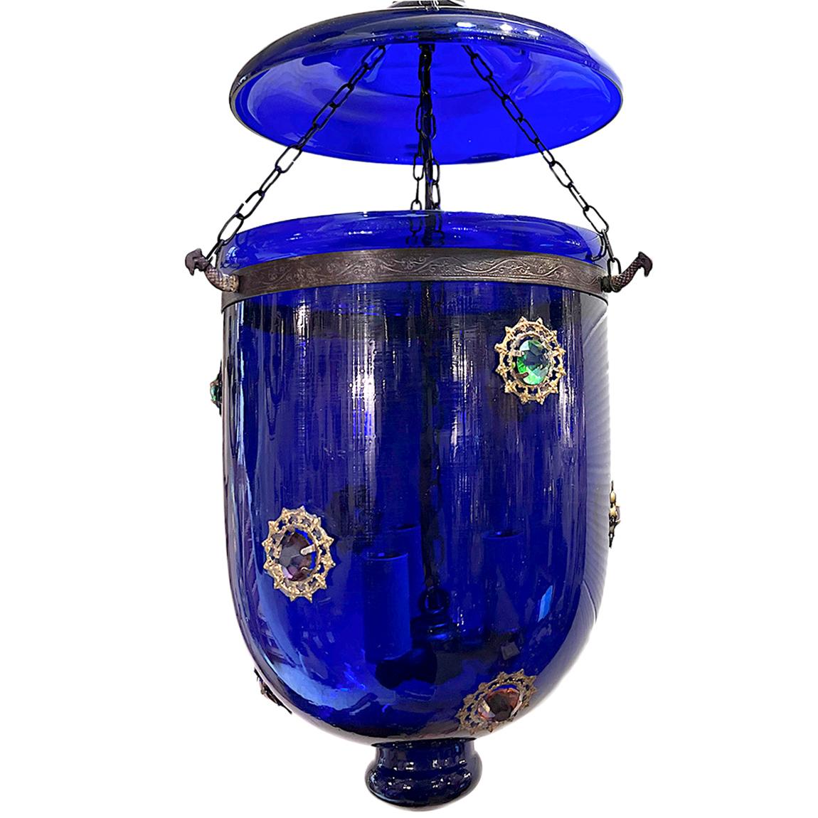 A circa 1950's Anglo Indian blue glass lantern with insert crystals.

Measurements:
Diameter: 10