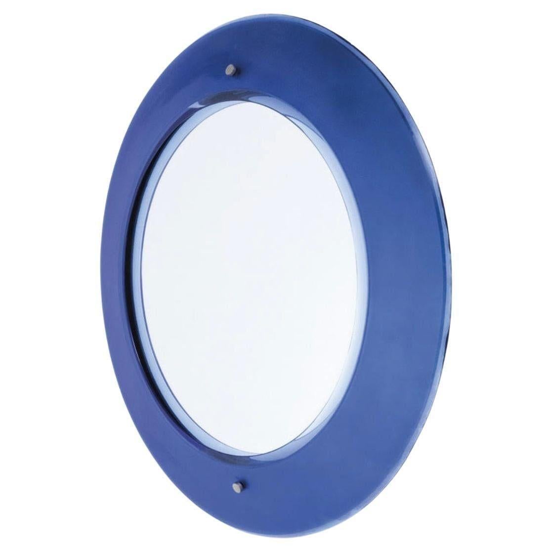 Vintage round mirror with a bevel deep cobalt blue Murano glass frame and mirrored center. It includes a wooden structure and has nickel-plated brass details. Produced by Fontana Arte, designed by Max Ingrand, Italy, c. 1960's.
*Information on