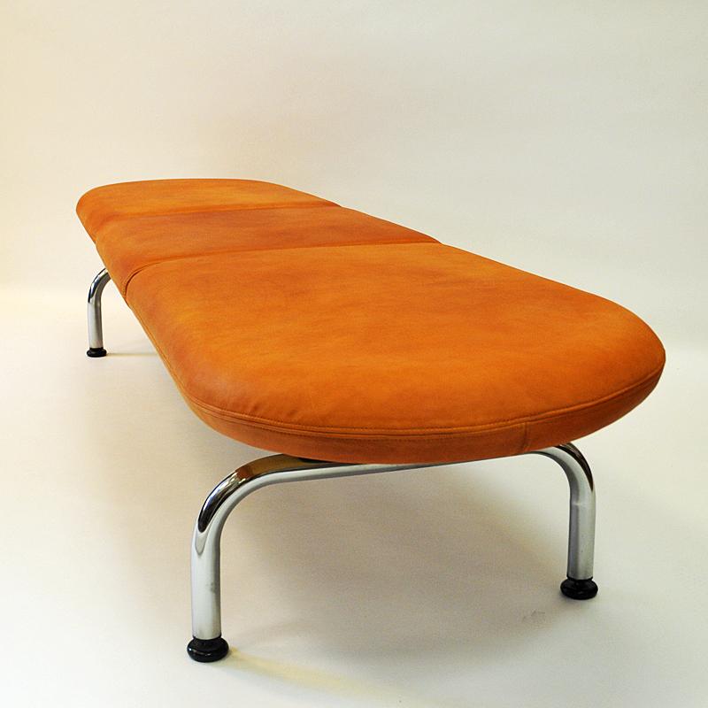 Marvelous sofa bench cobra designed by Johannes Foersom & Peter Hiort-Lorenzen for Erik Jørgensen Møbelfabrik in 1986 and then manufactured in the 1980s, Denmark. Cushions with beautiful cognac leather and a solid stainless steel frame underneath.
