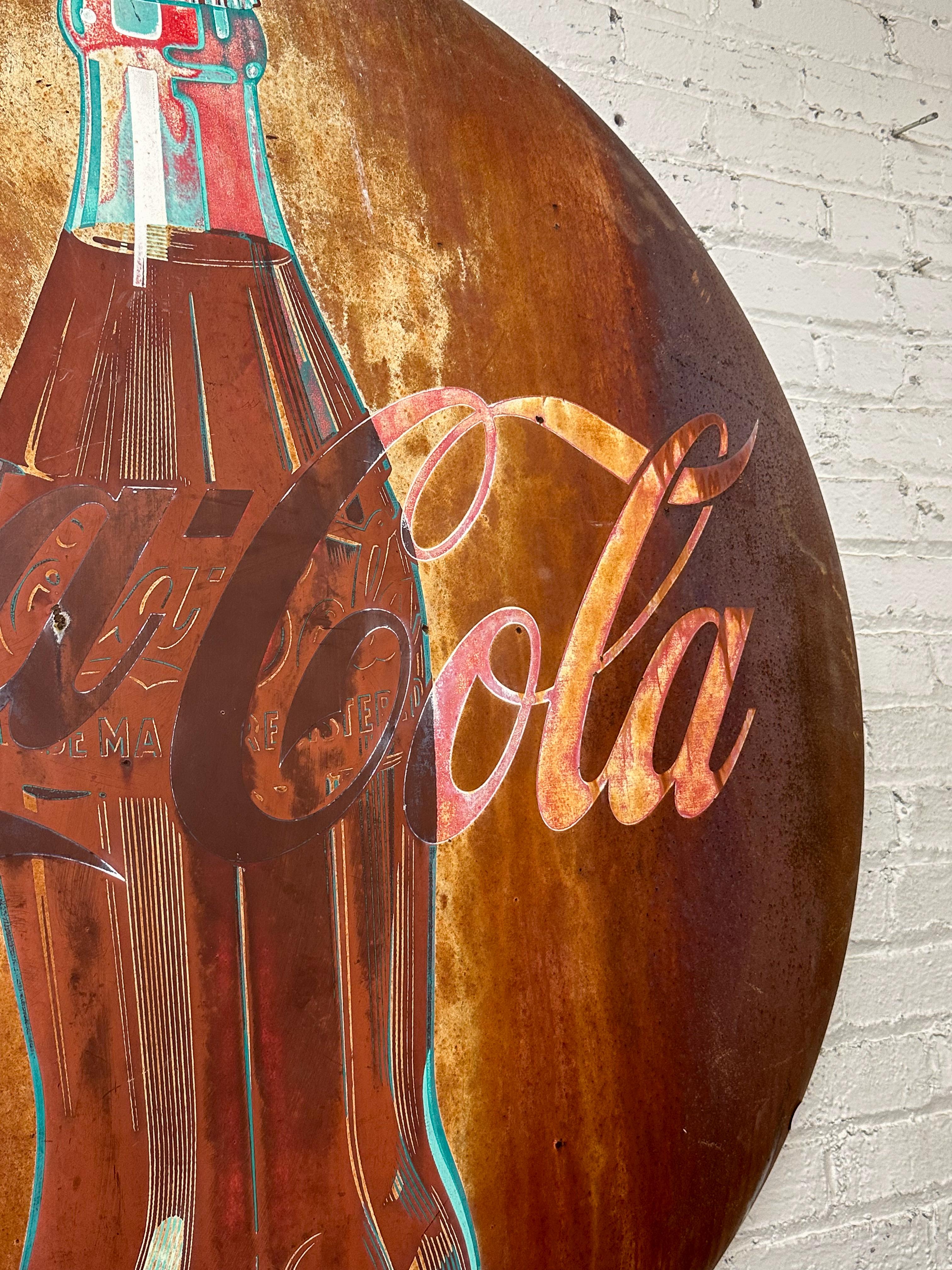 This original 1950s Coca-Cola sign has the perfect faded red look that gives it tons of character. With its worn-in, industrial vibe, this piece is an incredible find for any vintage decor lover or collector. It's ready to bring some retro flair and