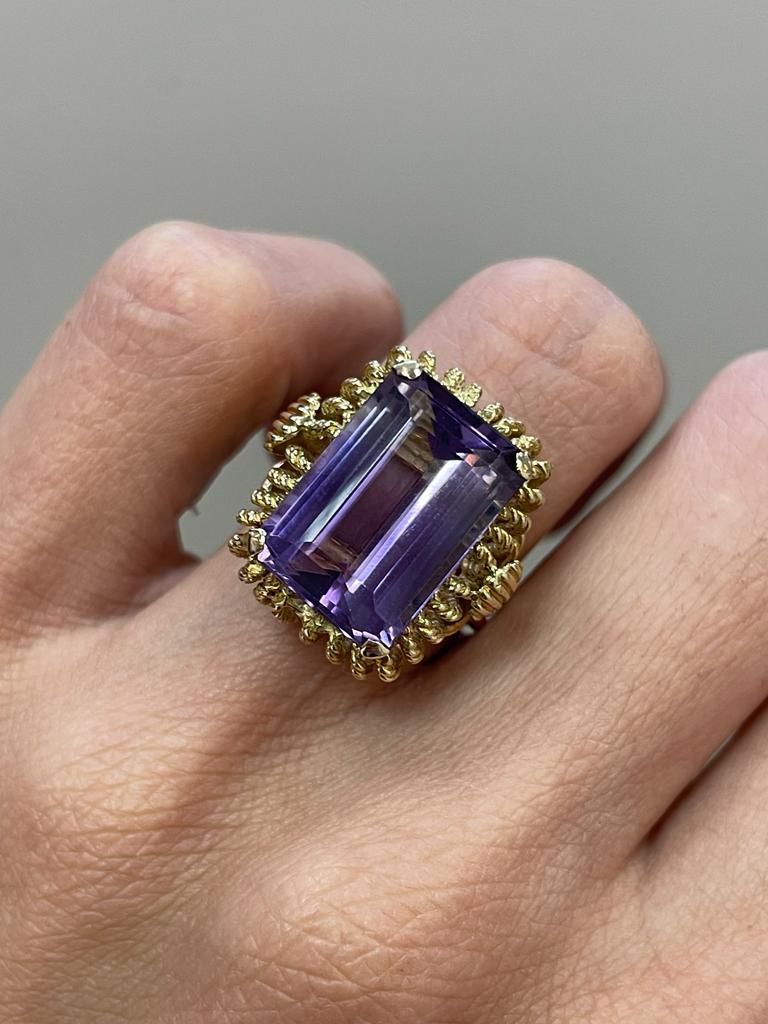 ~~ S e t t i n g ~~
Solid 18k Yellow Gold
9.70 grams
Ring Size 4.75,5,5.25,5.5,5.75;5.25 US
 
~~ Stones ~~


Main Stone:
Emerald Shape Natural Amethyst In Weight Of 10 Ct (Approx.)
Color  - Purple

Feel free to contact us for inquiries and