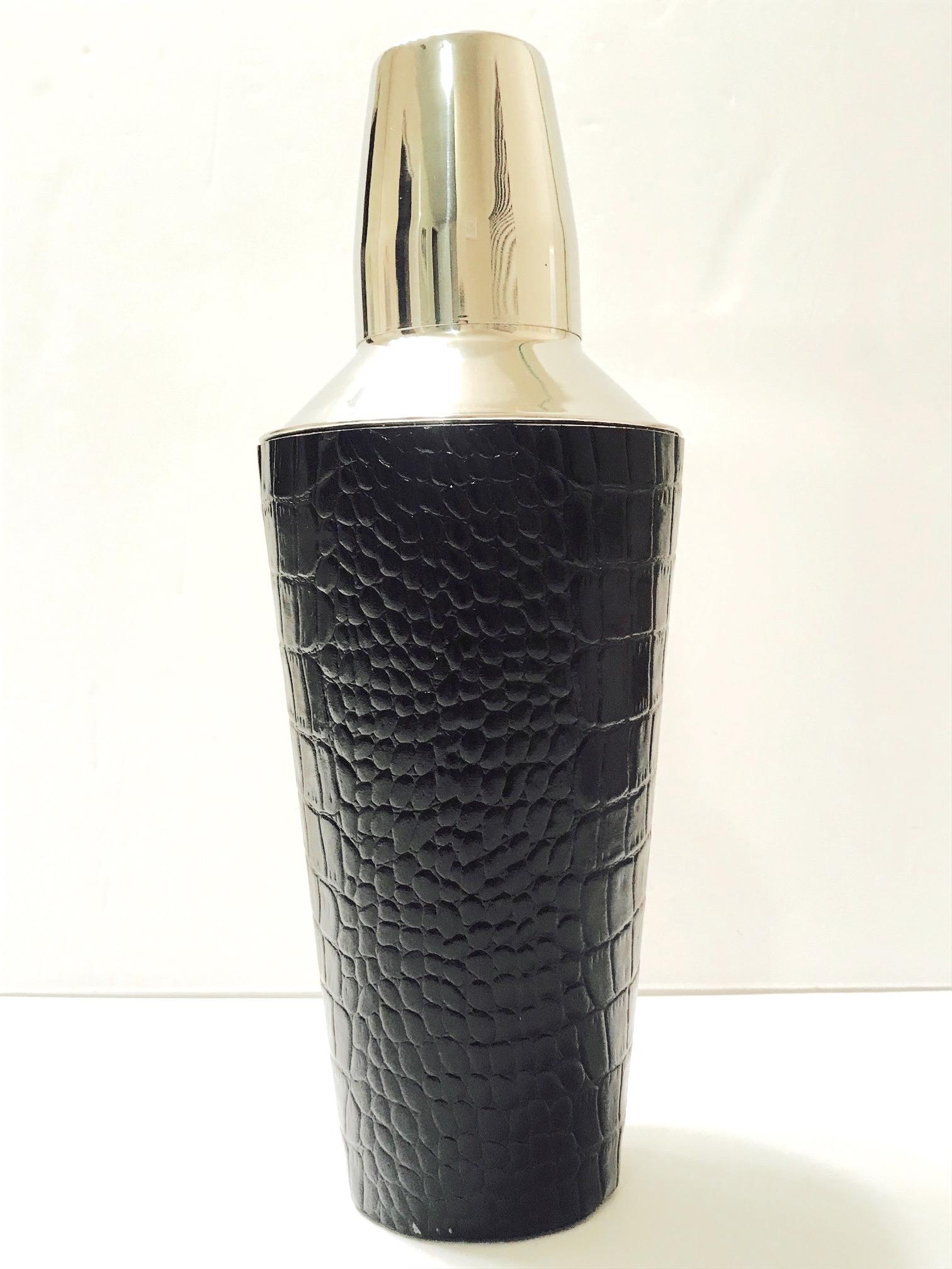 Chic martini shaker for the cocktail enthusiast. Stainless steel wrapped in embossed black leather with crocodile print. Has never been used and is in mint condition.