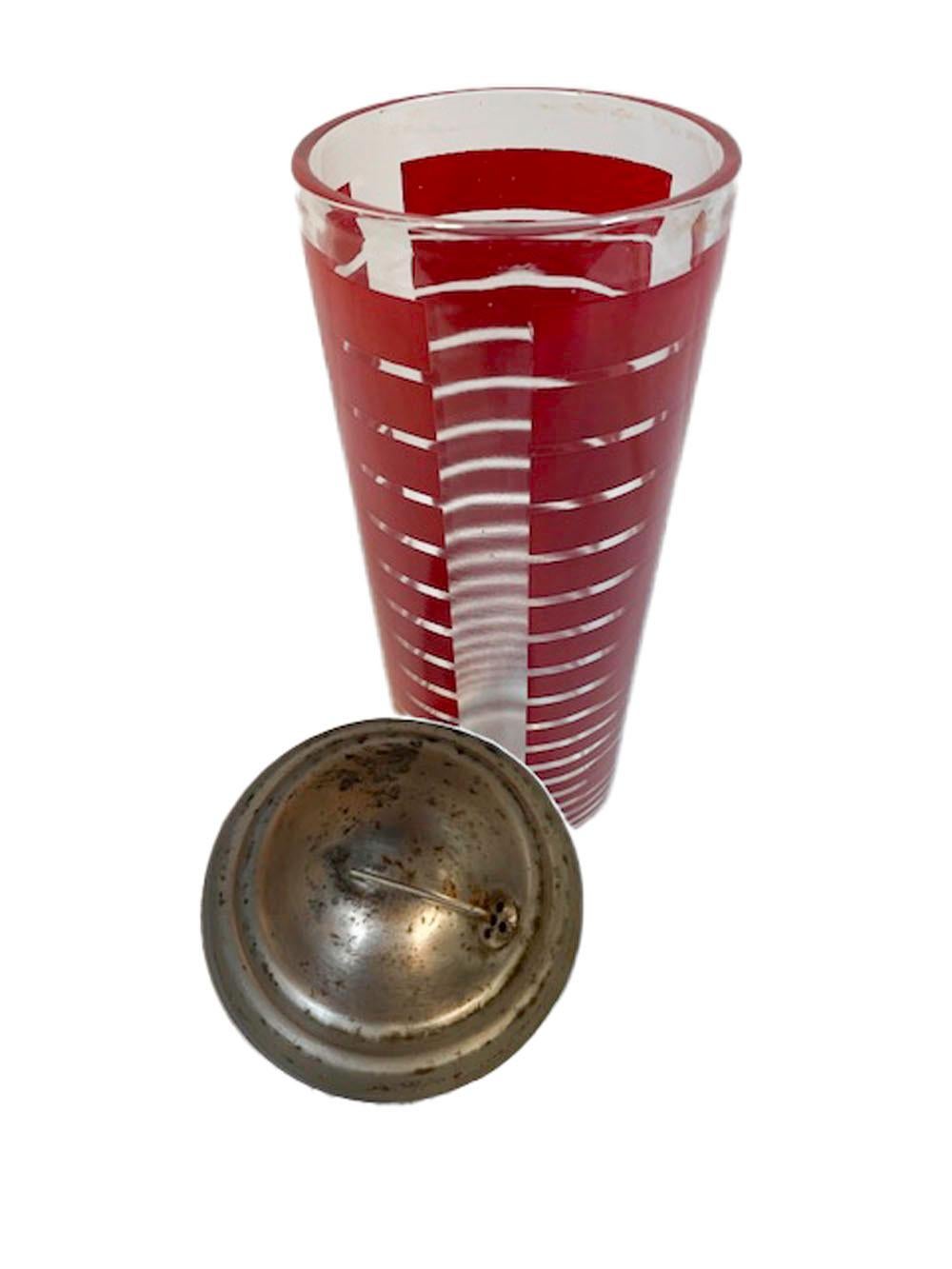 Mid-Century Modern clear glass cocktail shaker with three panels of graduated red enamel bars and having a domed chrome lid.