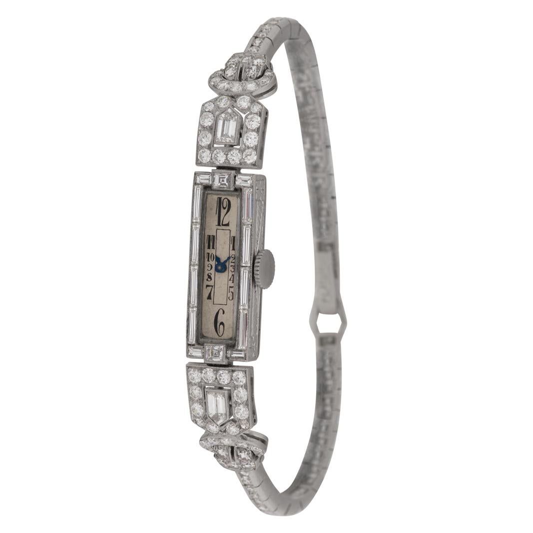 Vintage cocktail watch in platinum with over 3 carats in round, baguette, bullet and assher cut diamonds. Fits 5.5 inches wrist. Manual. Circa 1925 Fine Pre-owned N/A Watch.

Certified preowned Vintage Cocktail watch is made out of Platinum on a