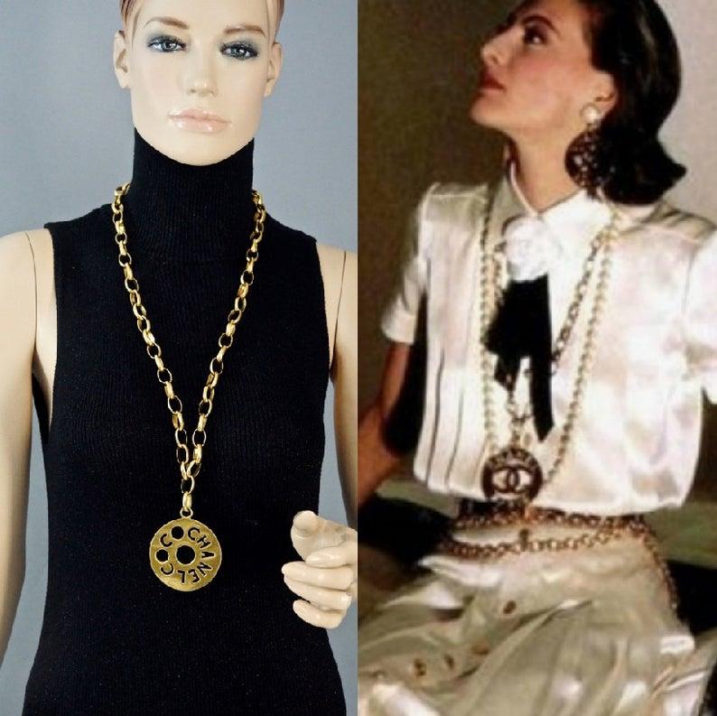 Vintage COCO CHANEL Cutout Openwork Logo Medallion Inès de la Fressange Necklace

Measurements:
Height: 2 3/8 inches (6.03 cm) 
Width: 2 3/8 inches (6.03 cm)
Chain: 31.10 inches (79 cm)

As seen on Inès de la Fressange for Chanel Advertisement in