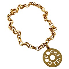 Vintage COCO CHANEL Cutout Openwork Logo Medallion Kim Kardashian Necklace