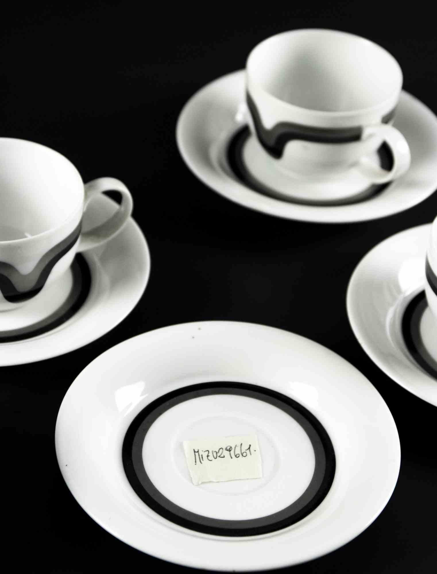 Vintage coffee set is an original decorative object realized in the 1970s.

Made in Ceramics.

Made in Germany

Various dimensions. Sugar bowl: 7 x 9.5 cm; cups: 6 x 8 cm; saucers: 15 x 15 cm. 

The label 