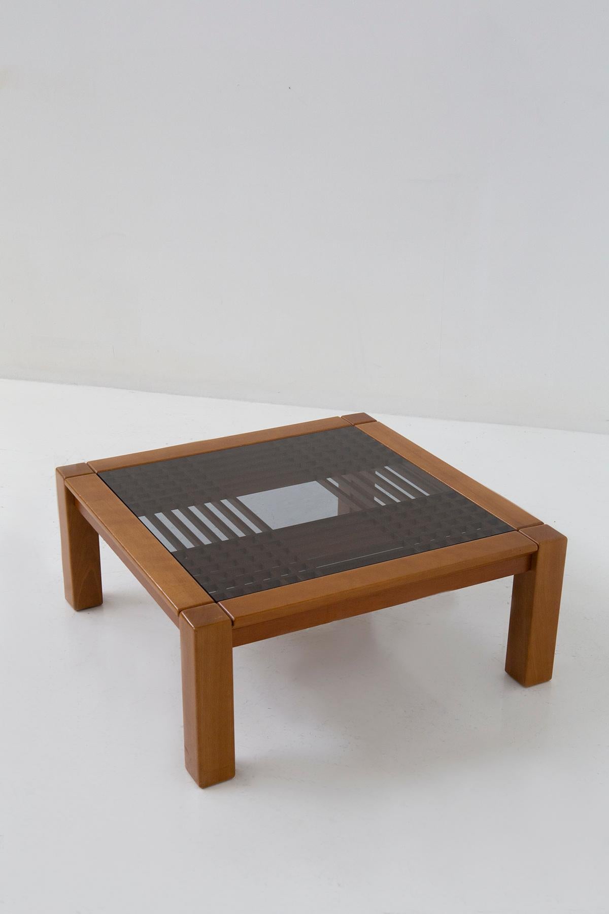 Step into the world of timeless elegance with this exquisite modernist coffee table, a true masterpiece designed by none other than the legendary Ettore Sottsass during the vibrant 1960s. Crafted with precision by Santambrogio & De Berti, this table