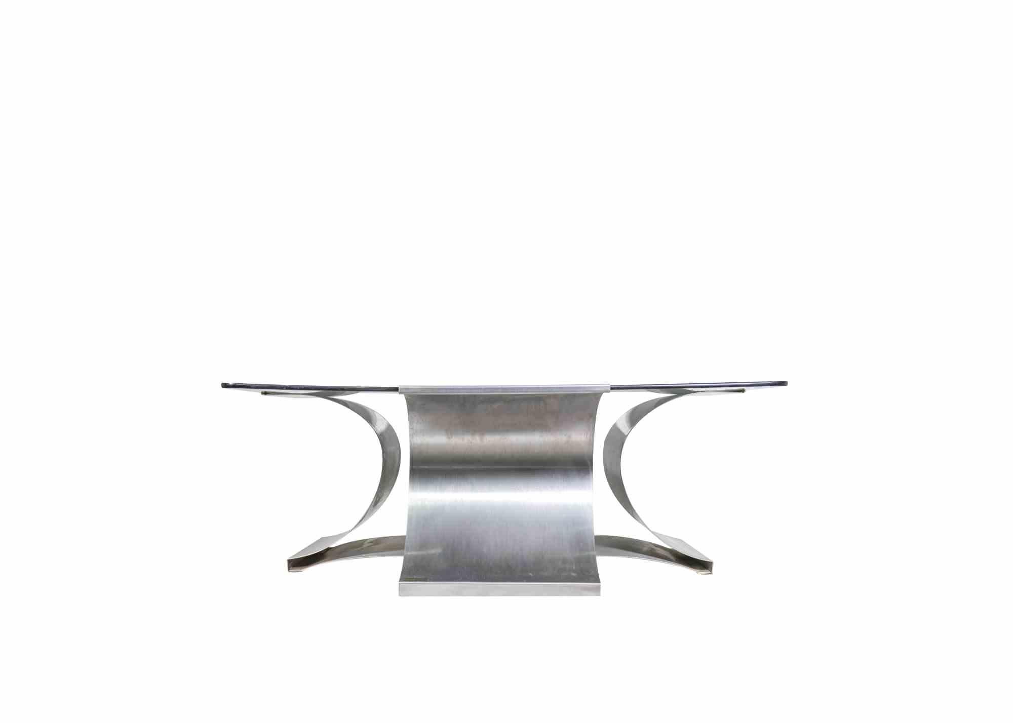 Coffee table attr. to François Monnet.

Shaped steel and glass coffee table for Kappa, 1970s.

Measures : 90x90 x 35 cm.

Good conditions.