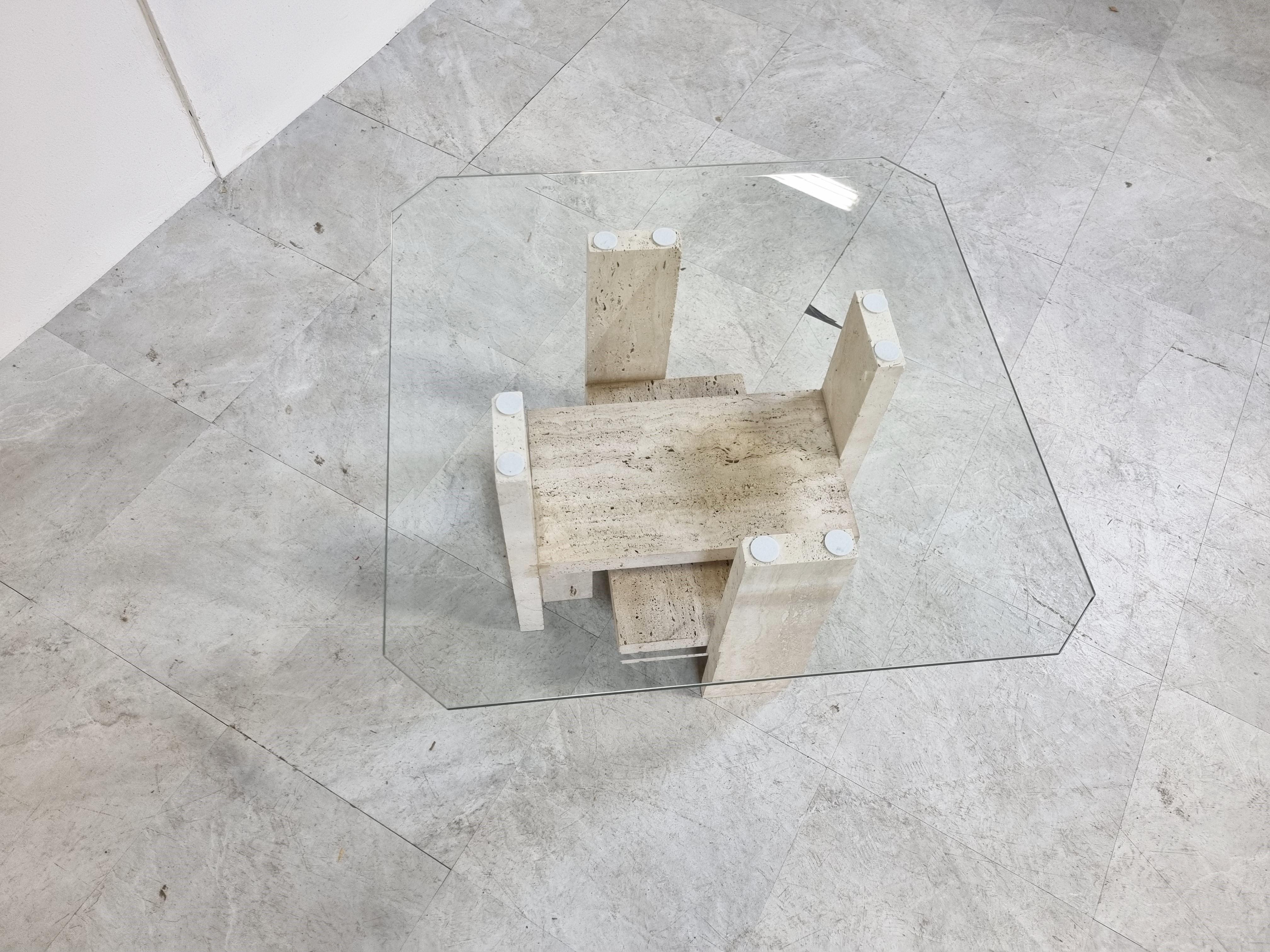 Architectural coffee table made from a solid travertine base and with a beveled glass top.

The table was designed by Willy Ballez.

The modern look/design mixes well with nowadays interiors, especially with the light color of the