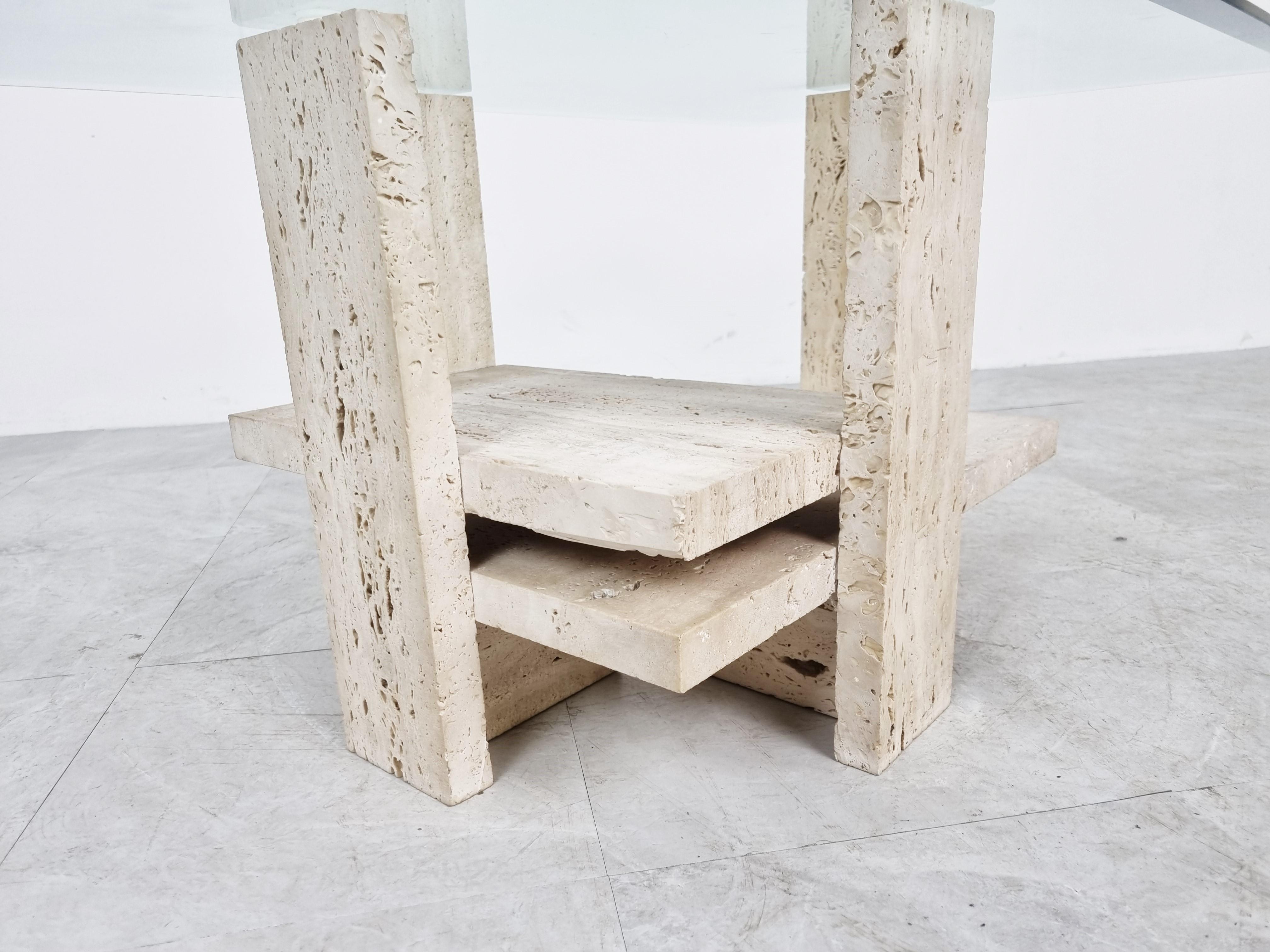 Architectural coffee table made from a solid travertine base. 

The table was designed by Willy Ballez.

All these tables are hand made, so they are always a bit different.

The modern look/design mixes well with nowadays interiors, especially