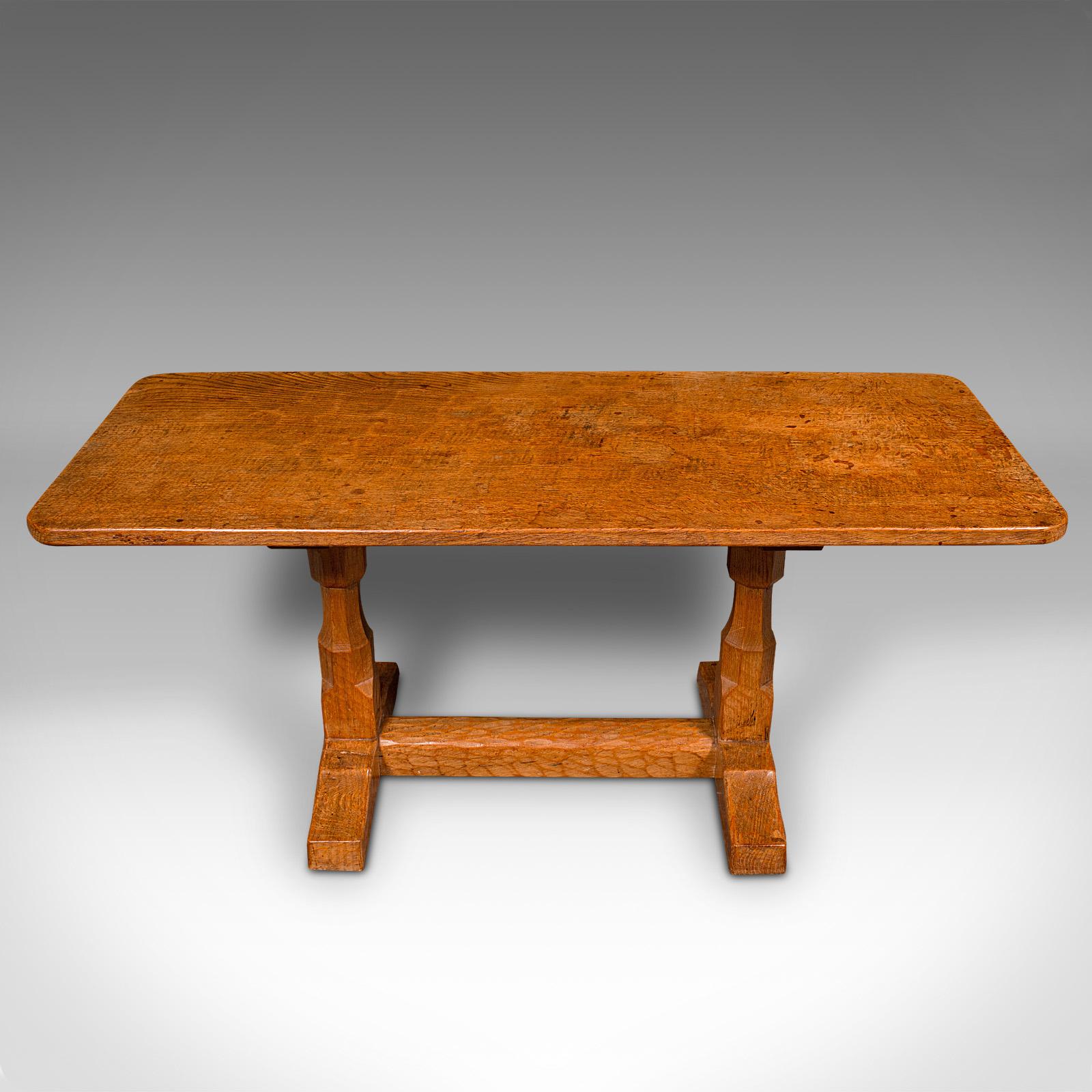 This is a vintage coffee table. An English, oak decorative lounge table in the manner of Robert Thompson 'Mouseman', dating to the late 20th century, circa 1970.

Delightful coffee table with a distinctive aesthetic appeal
Displays a desirable aged