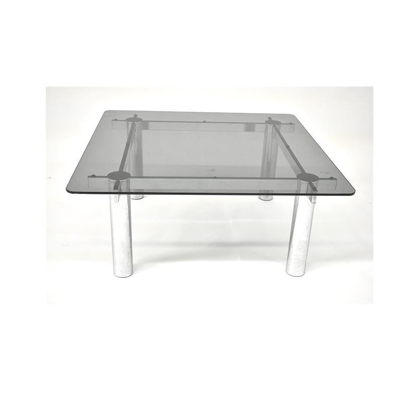 Vintage coffee table from the 1970s, Italian manufacture.
The coffee table has a square structure with chromed steel frame and smoked glass top.
   