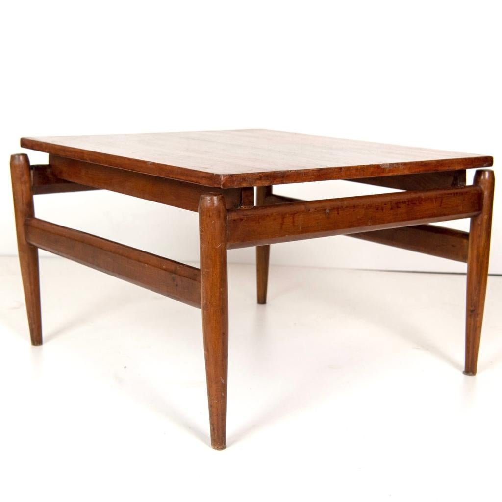 A vintage coffee table designed in the 1960's from Ico Parisi, iconic italian designer from the 1950 - 1960s. Solid wood structure with elegantly carved wood frame and floating wood top. Wood has been polished. Item in really good conditions with