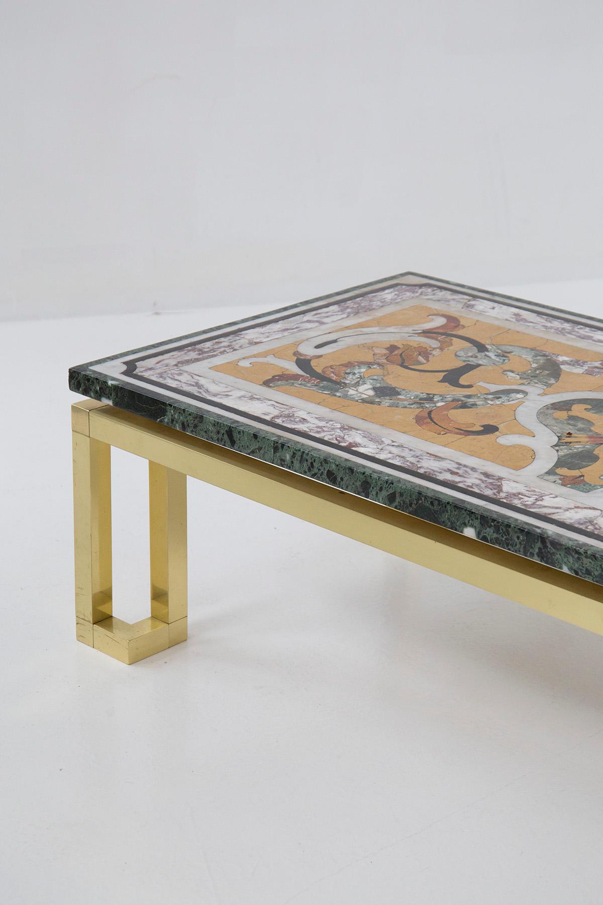 Beautiful coffee table from the 1950s of fine Italian manufacture. The marble is older from the late 1800s.
The base of the coffee table is made of very beautiful golden brass, has 4 legs for support: they have a very distinctive square shape with