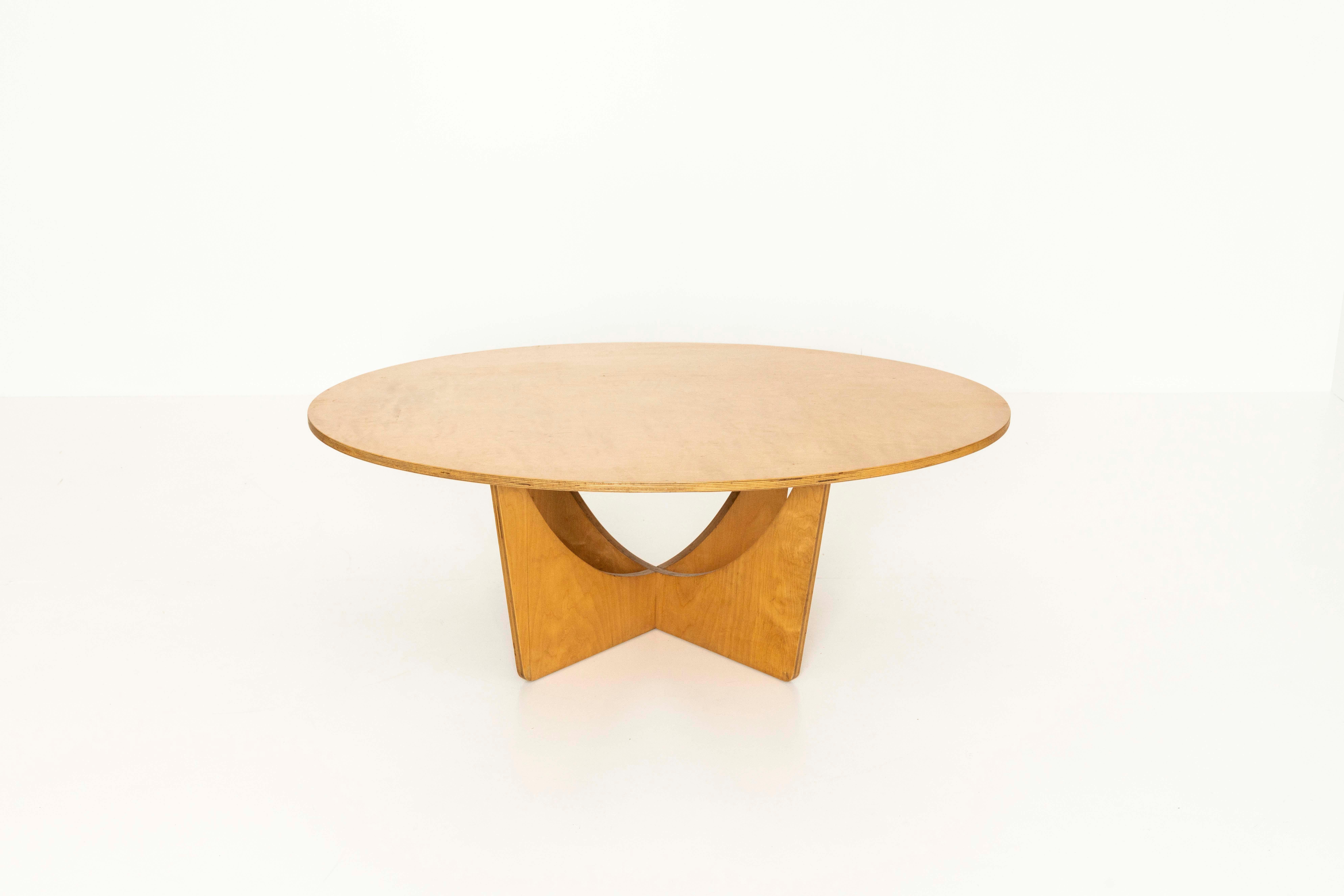 Vintage coffee table in The Style of British designer Gerald Summers, 1950s. This table has an oval top and an interestingly shaped base. It is made of plywood and has an attractive design. The table has some wear and tear due to its age, however