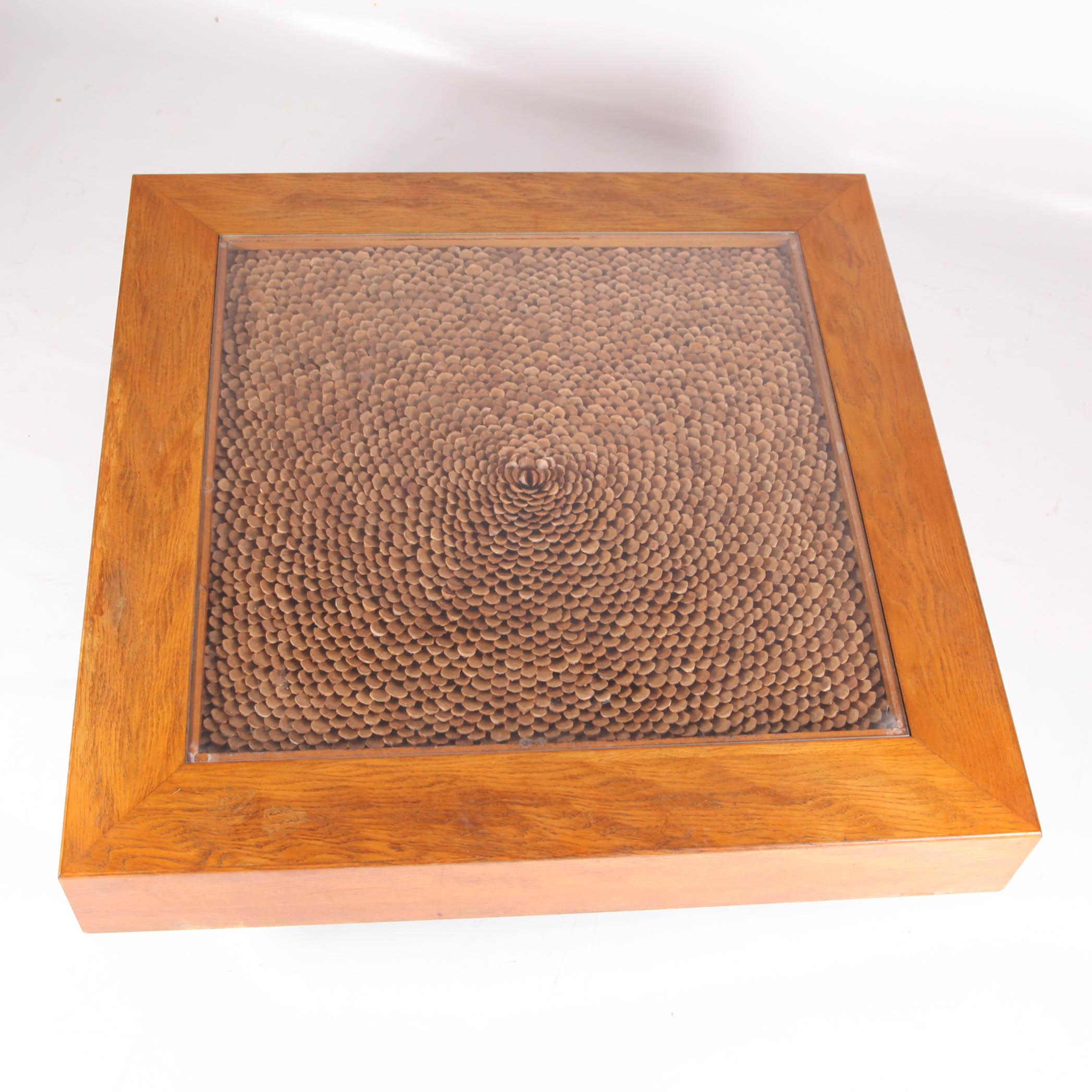 Vintage coffee table in wood and scales of pine cones with glass top attributed to Roméo Rega in good condition. Very good size. Perfect for natural decor.