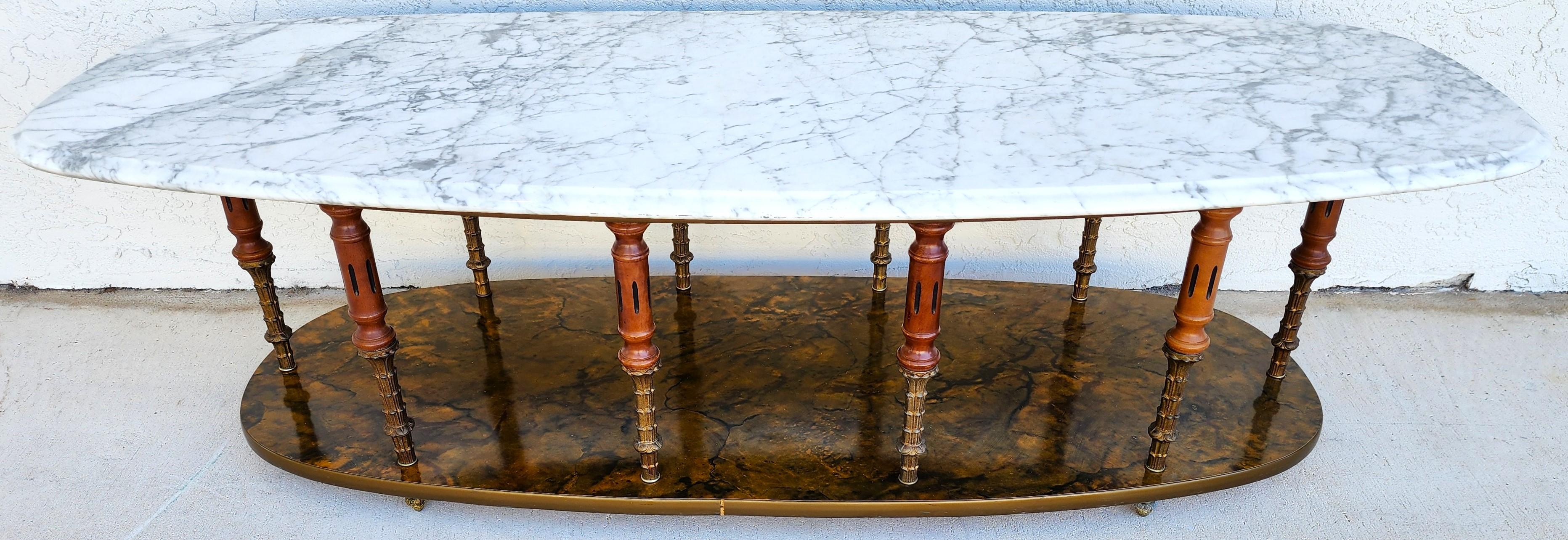 For FULL item description click on CONTINUE READING at the bottom of this page.
Offering One Of Our Recent Palm Beach Estate Fine Furniture Acquisitions Of A
Vintage Italian Regency Coffee Table With Ogee Beveled Edge Carrera Marble and Brass and