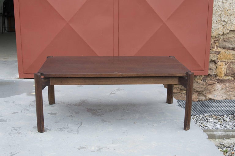 This coffee table was made in Italy in the 1970´s most likely by Tecno.
We attribute to architect Borsani
Its design is elegant and modern. The table is made of high quality teak wood. It has straight legs, a rectangular top and beautiful details