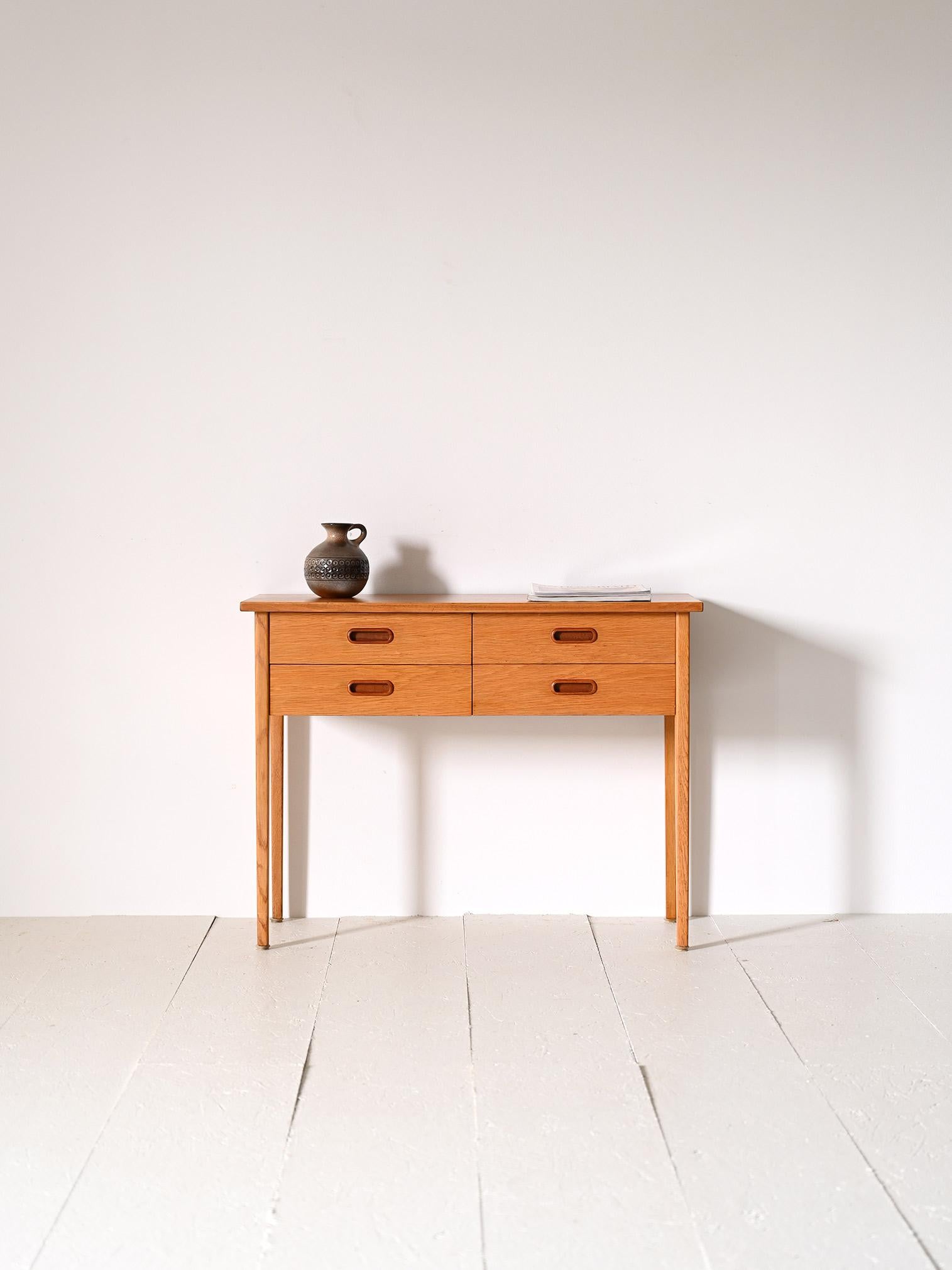 Small Scandinavian console table from the 1960s.

A retro-style piece of furniture that, thanks to its small size and the presence of drawers, can be used as a side table for the entrance hall, bathroom, hall, as well as a bedside table.
Consisting
