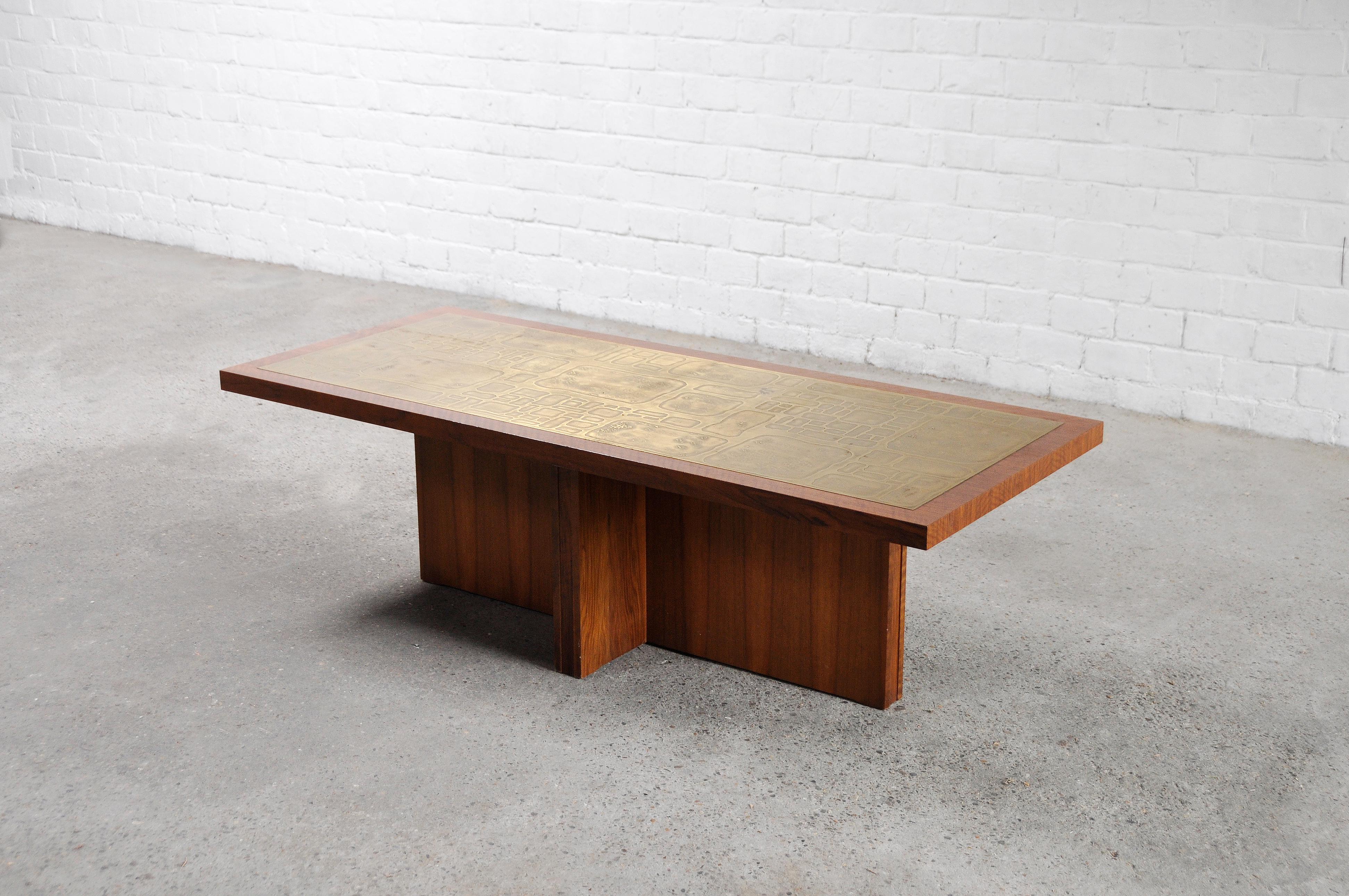 An impressive vintage coffee table designed by Bernard Rohne, crafted in the 1960's. This unique piece features a warm walnut wood base with an eye-catching large etched copper plate on top, representing the essence of modernist and Mid-century