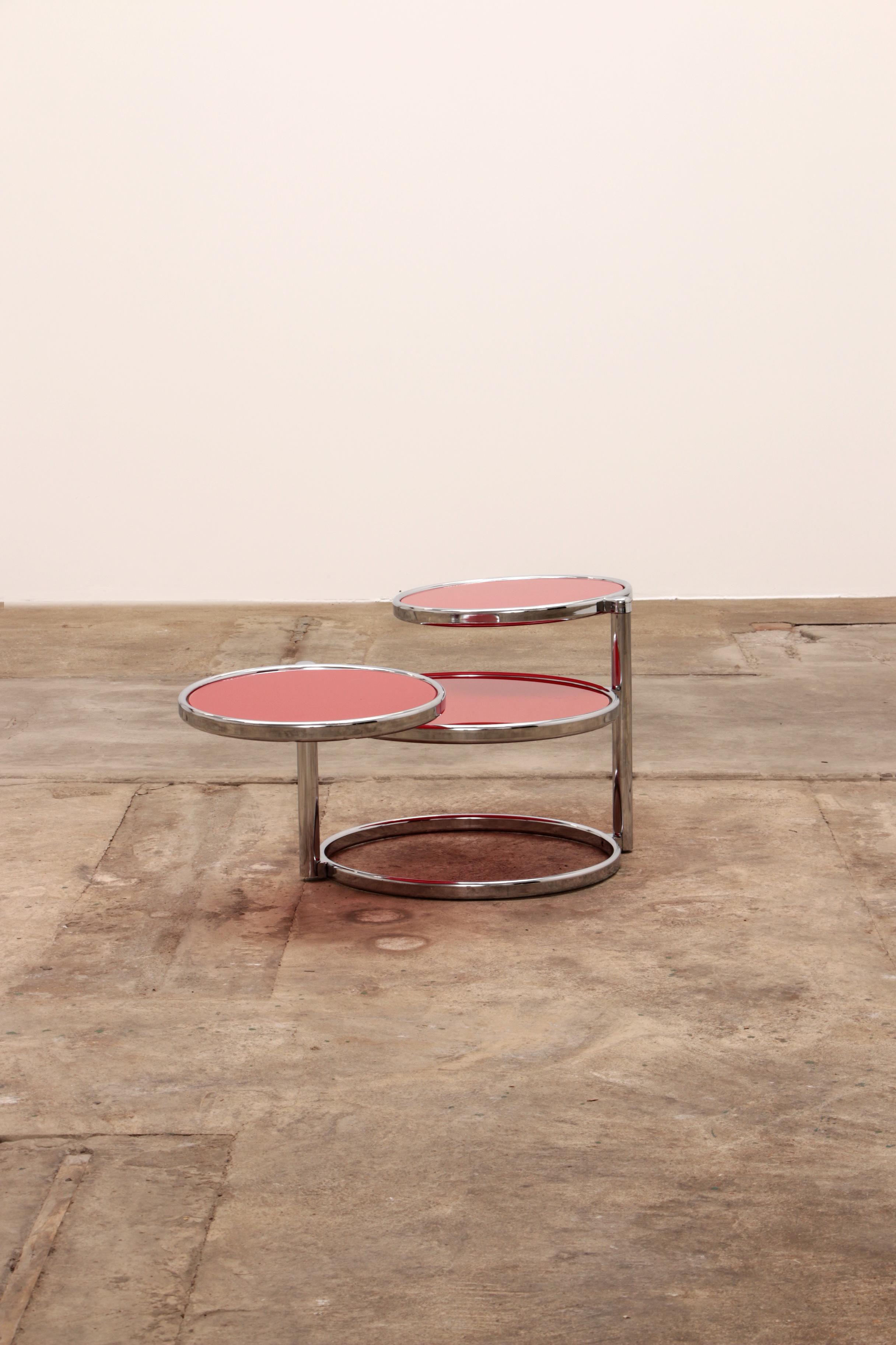 Nice chrome coffee table with two rotating tables.

If you don't have much space, you can fold out the table and you have more table. The red glass plates have signs of use.

Sustainable: environmentally conscious By supplementing your interior
