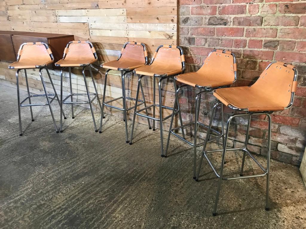 These are the rarest tallest stools by Charlotte Perriand available!

Sought after six leather Charlotte Perriand stools for Les Arcs, 1960.

Six Charlotte Perriand stools from France, stunning stools very unusual and sought after, these were