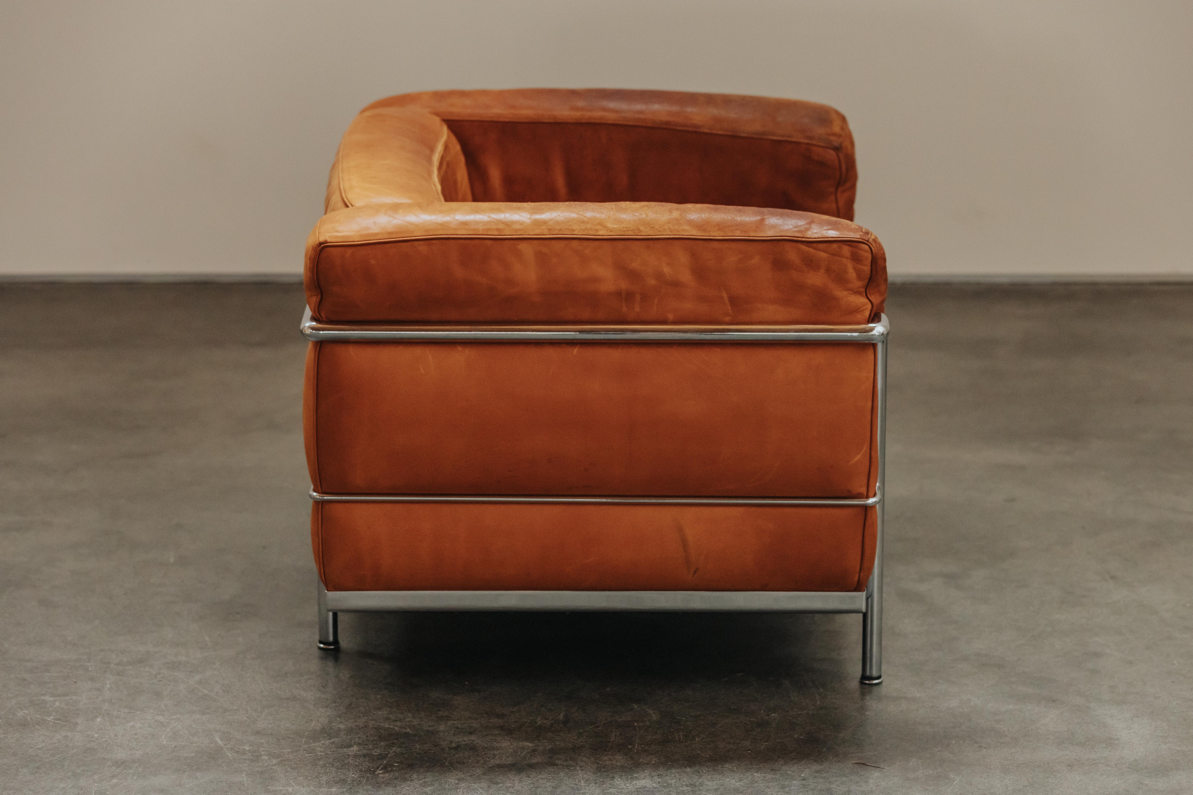 Vintage Cognac Leather Lounge Chair From France, Circa 1970.  Original leather cushions with great patina and use.