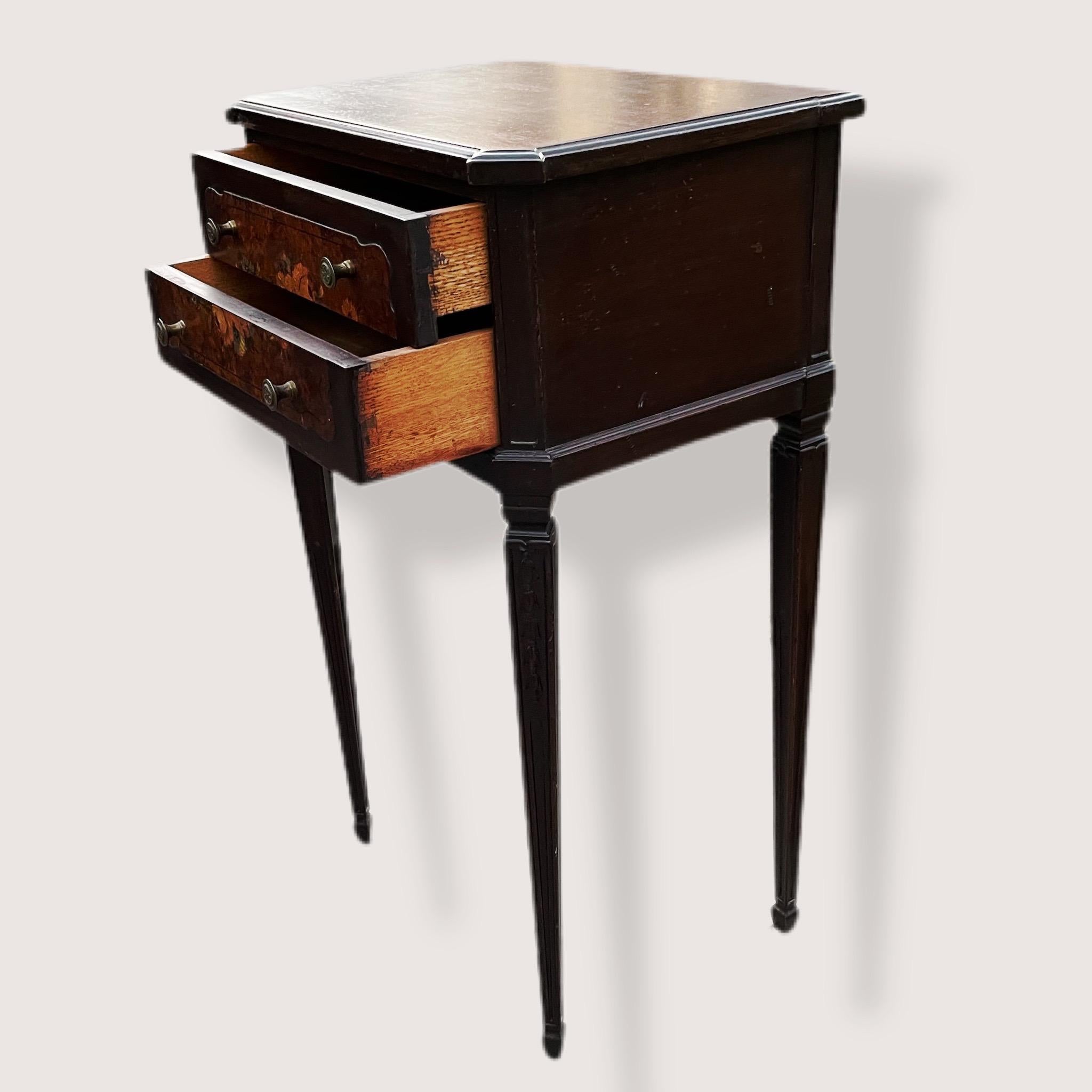 Two drawer Sheraton side table. Handcrafted. In overall good condition. Some dings on the sides and the top. Appears to have the veneer repaired on the front. Hand carved legs with a neat embellishment/design. Dovetailed joinery by hand, not machine.