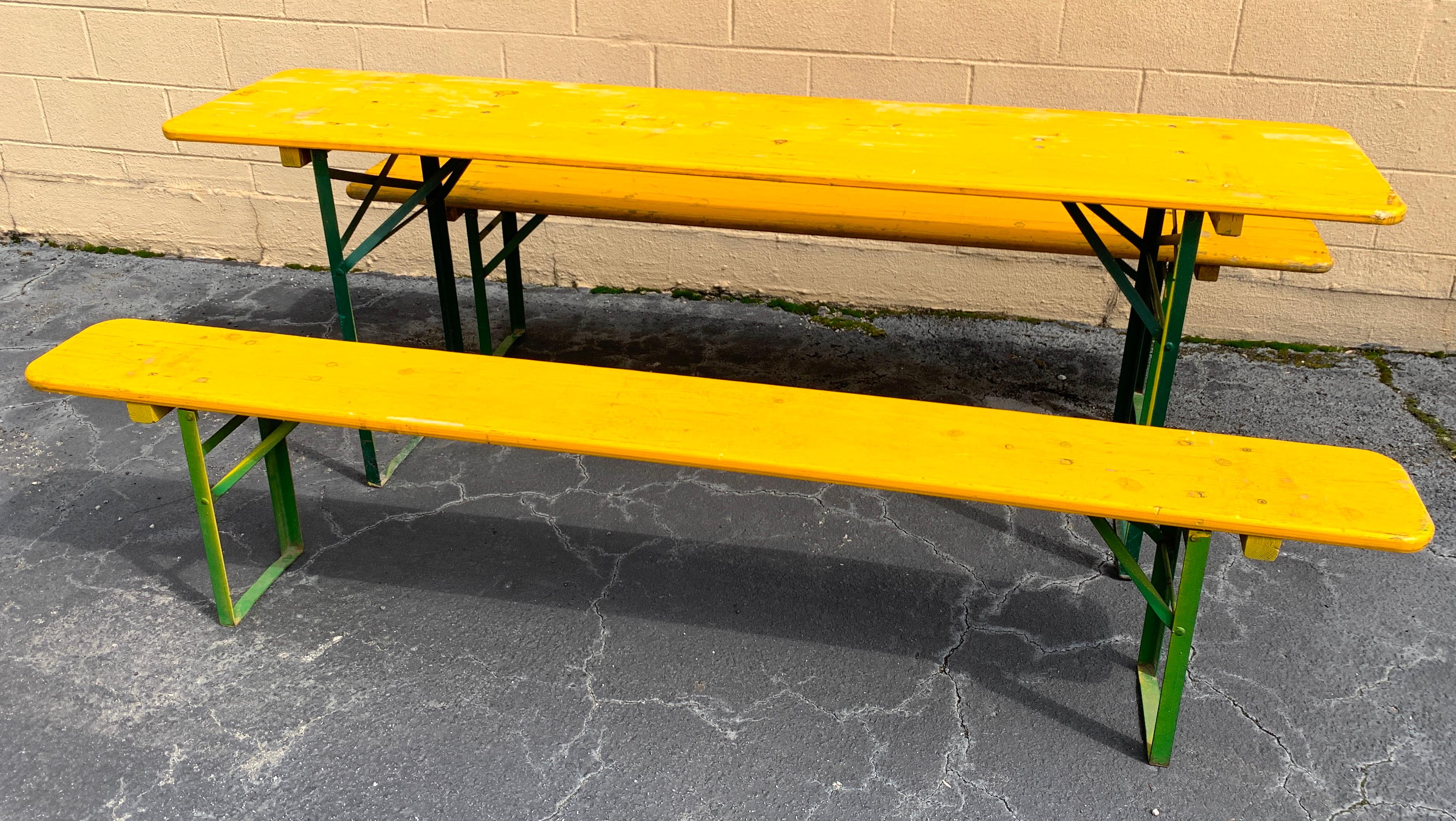 Vintage collapsable German beer garden table and bench set, in yellow
Consisting of a folding table and two folding benches in vintage yellow paint.
Great size and color, very sturdy, show signs of use and wear, patina. Structurally sound,