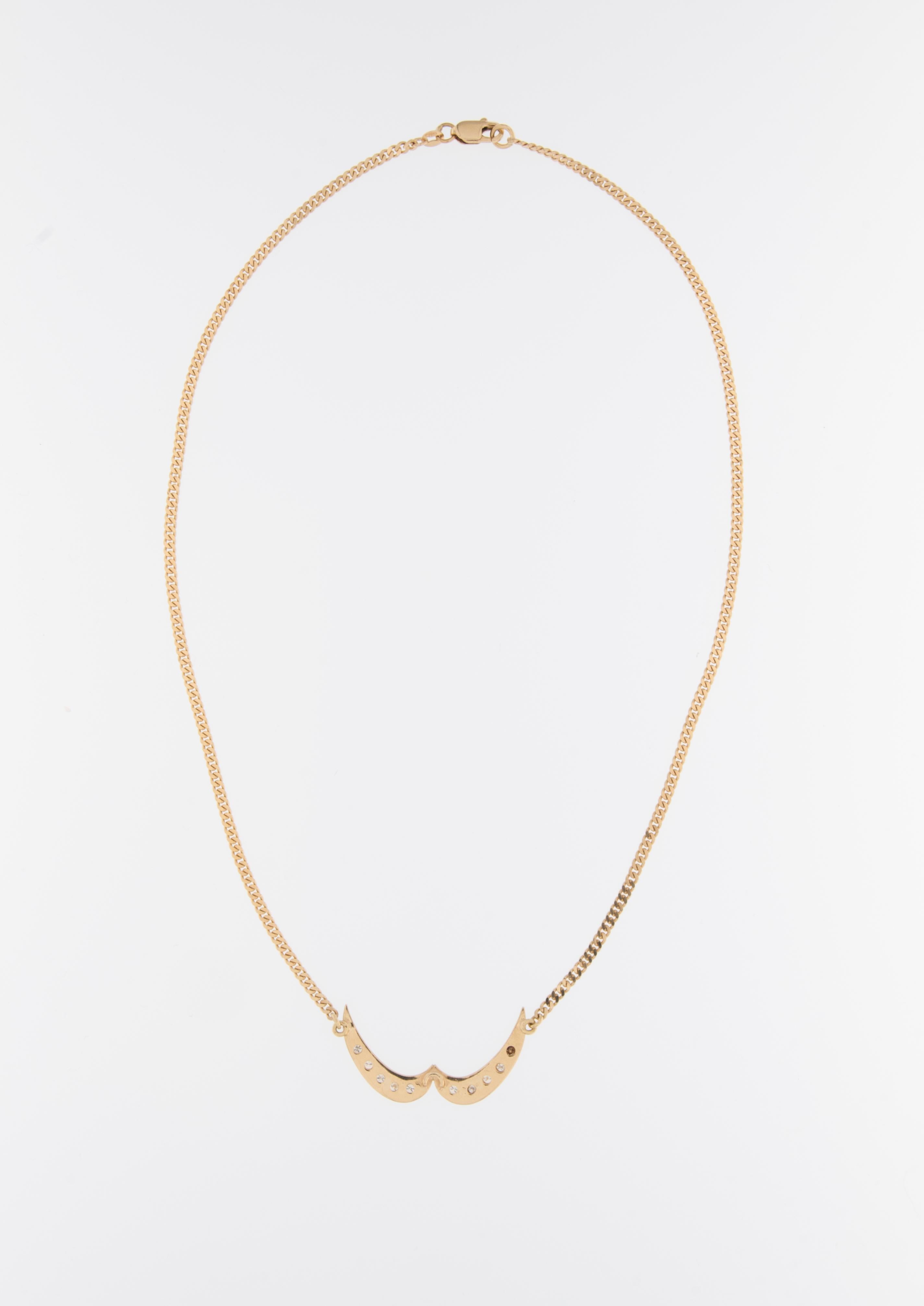 The Vintage Collar Shape Necklace is an exquisite piece of jewelry crafted from 18kt yellow gold and adorned with diamonds. 

The necklace is made from 18kt yellow gold, which is known for its timeless beauty and durability. This high-quality gold