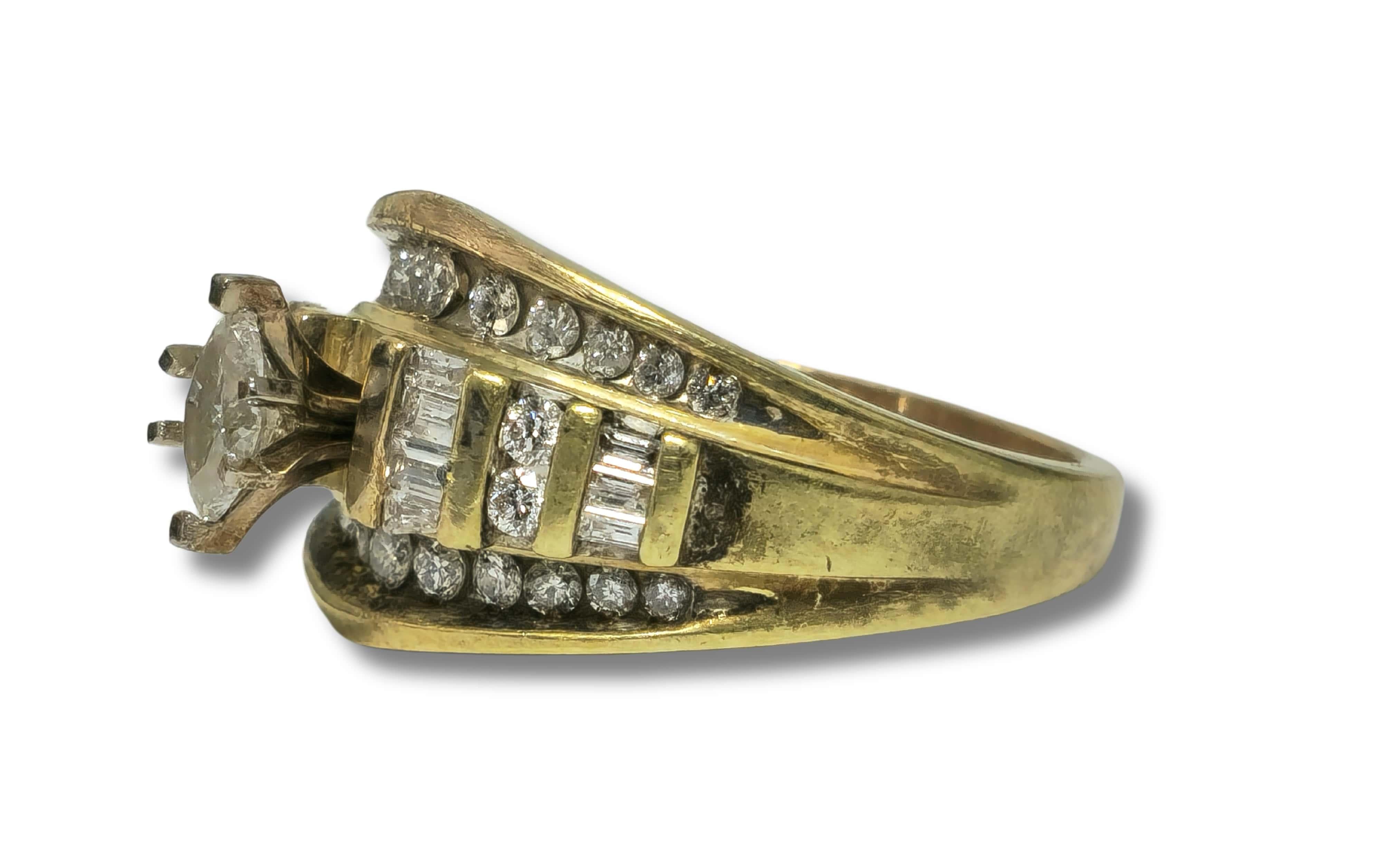 Embrace timeless elegance with our Art Deco Style Vintage Diamond Engagement Ring. Crafted from lustrous yellow gold, this exquisite ring features a dazzling array of diamonds in round, baguette, and marquise cuts, radiating natural brilliance and