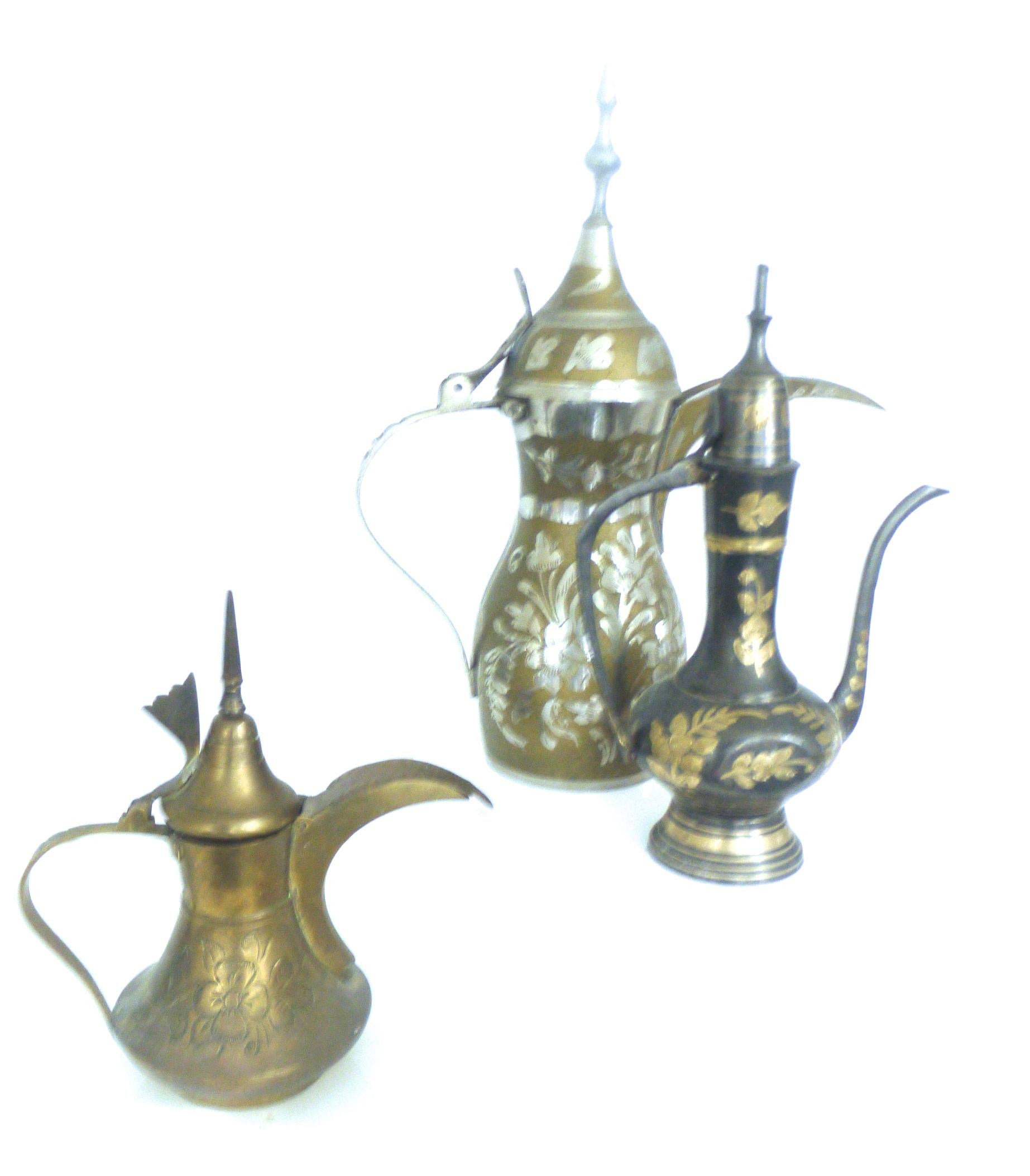 Vintage collection of decorative three Islamic Dallah coffee pots from Morocco
We have several small collections - offers for additional collections welcomed.

Size: Large Middle Eastern brass coffee pot
Height 29 cms, diameter at widest