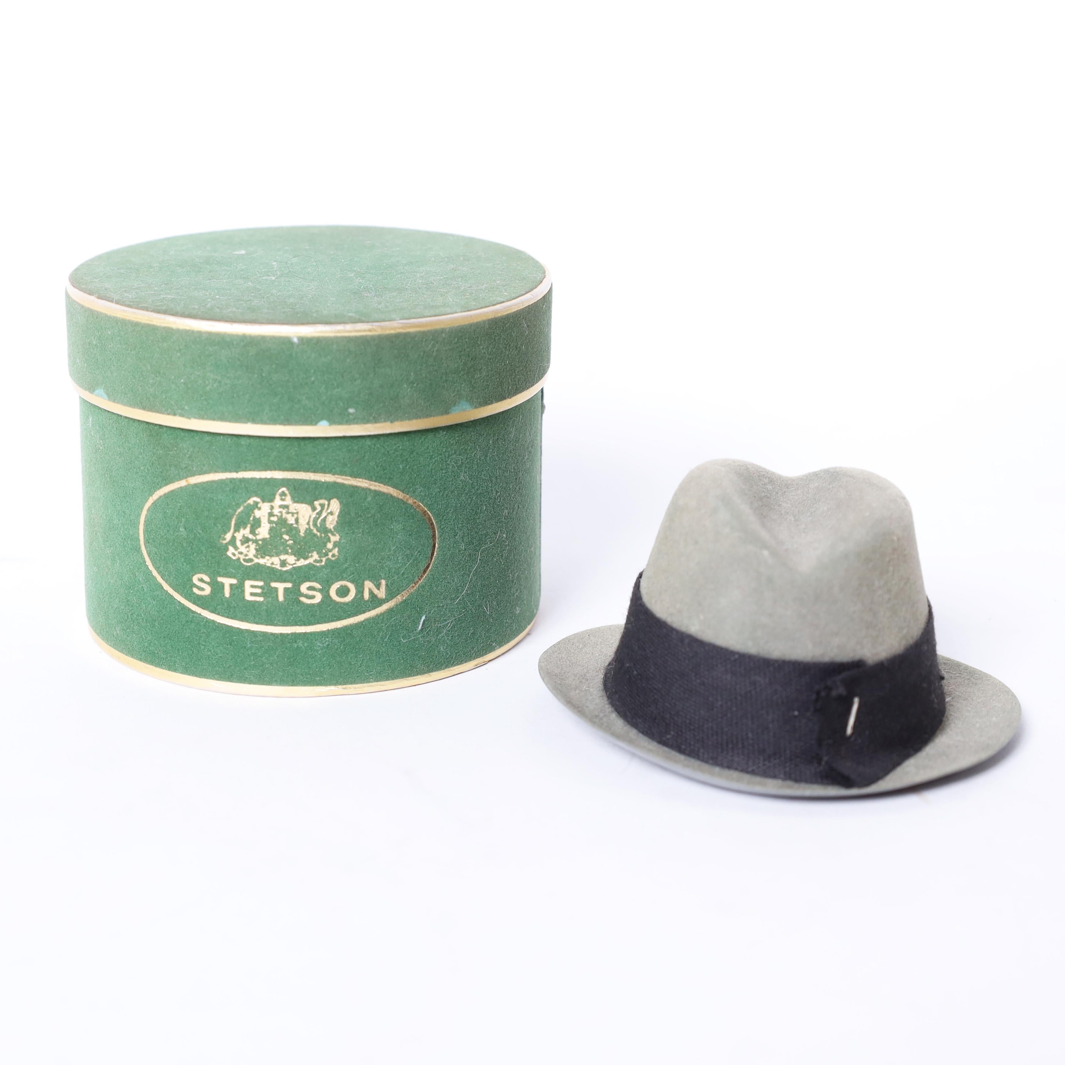 Rare and unusual collection of vintage miniature hat boxes with hats representing America's iconic hat companies of the time. Customers would buy them to give as gifts, then the recipient would bring it to the store and choose a hat. Part of a