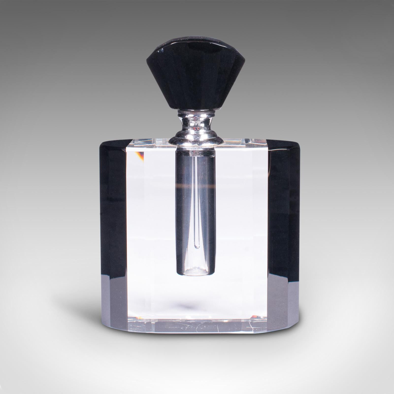 This is a vintage cologne bottle. An English, glass fragrance or aftershave dropper in late Art Deco taste, dating to the mid 20th century, circa 1950.

Striking elegance - graced with Liberty-esque overtones
Displaying a desirable aged patina -