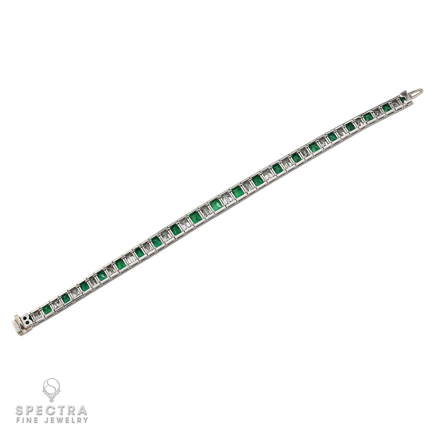 This vintage tennis bracelet, crafted in the 1950s, features 21 stunning emerald-cut Colombian emeralds, totaling approximately 11-12 carats. Each emerald showcases the rich, vibrant green hue that Colombian stones are celebrated for, with minor