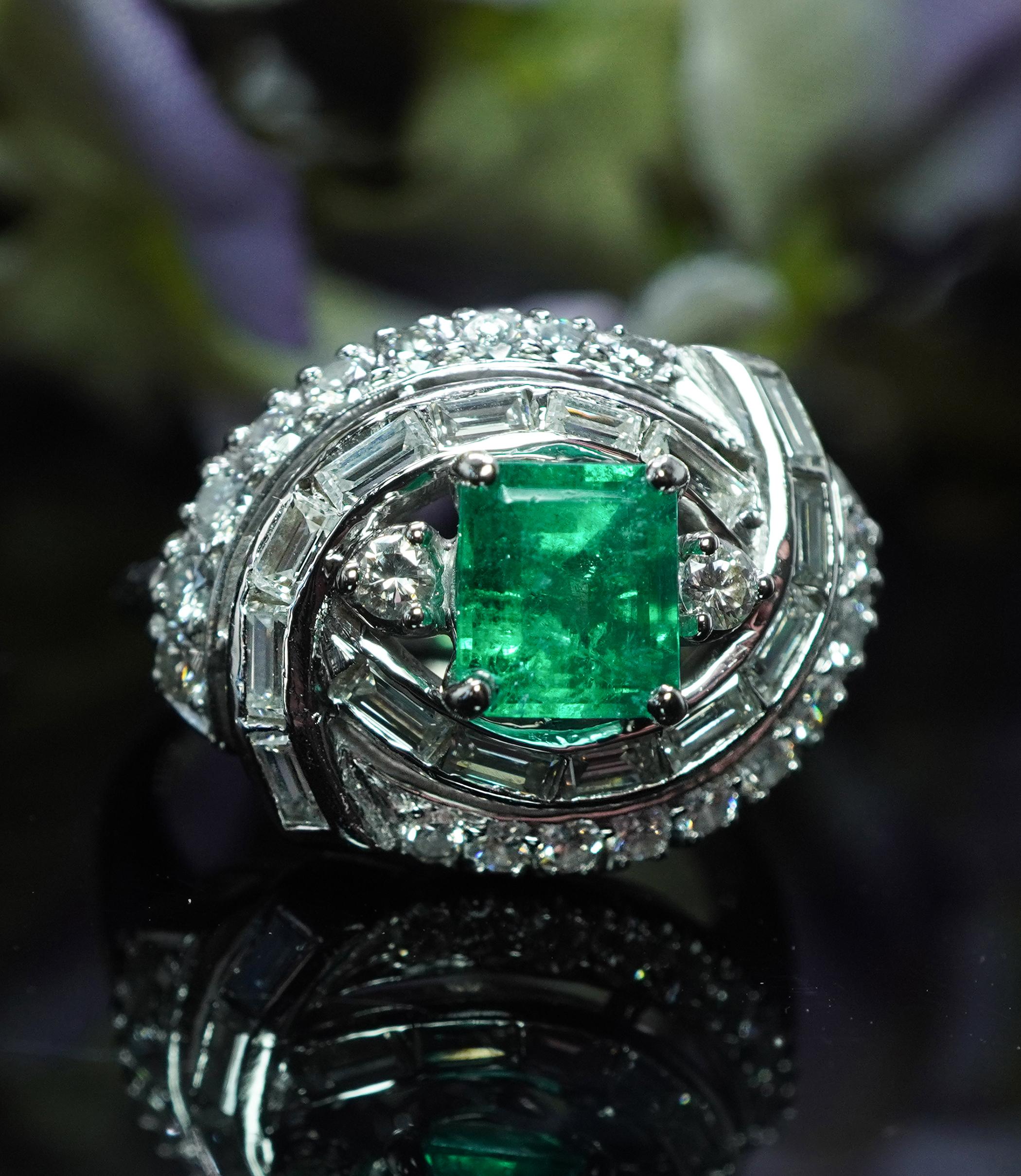 Vintage Colombian Emerald Baguette Diamond Ring Platinum Estate Midcentury

 What a great ring, circa 1950s design!  It has it all, a beautiful emerald and brilliant diamonds all set in a fascinating design. Fantastic piece of estate jewelry crafted