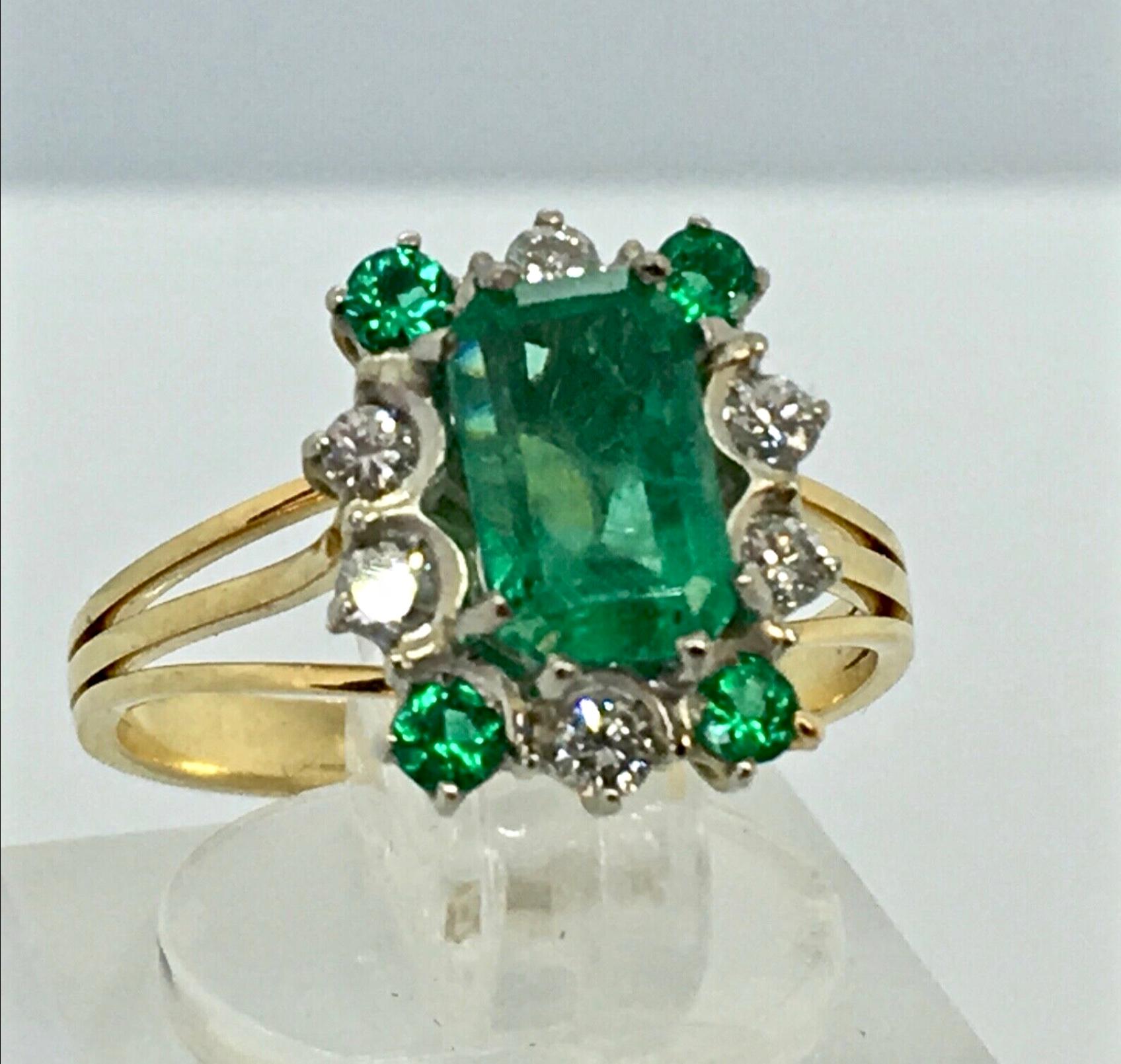 Vintage Stunning Colombian Emerald Solitaire Ring with Accents 

Colombian Emerald and Diamond Ring prong set in White and Yellow solid 18K gold. Feature one Genuine and natural Colombian Emerald (Emerald cut) weighing 2.50ct/ Vivid Medium Green. 